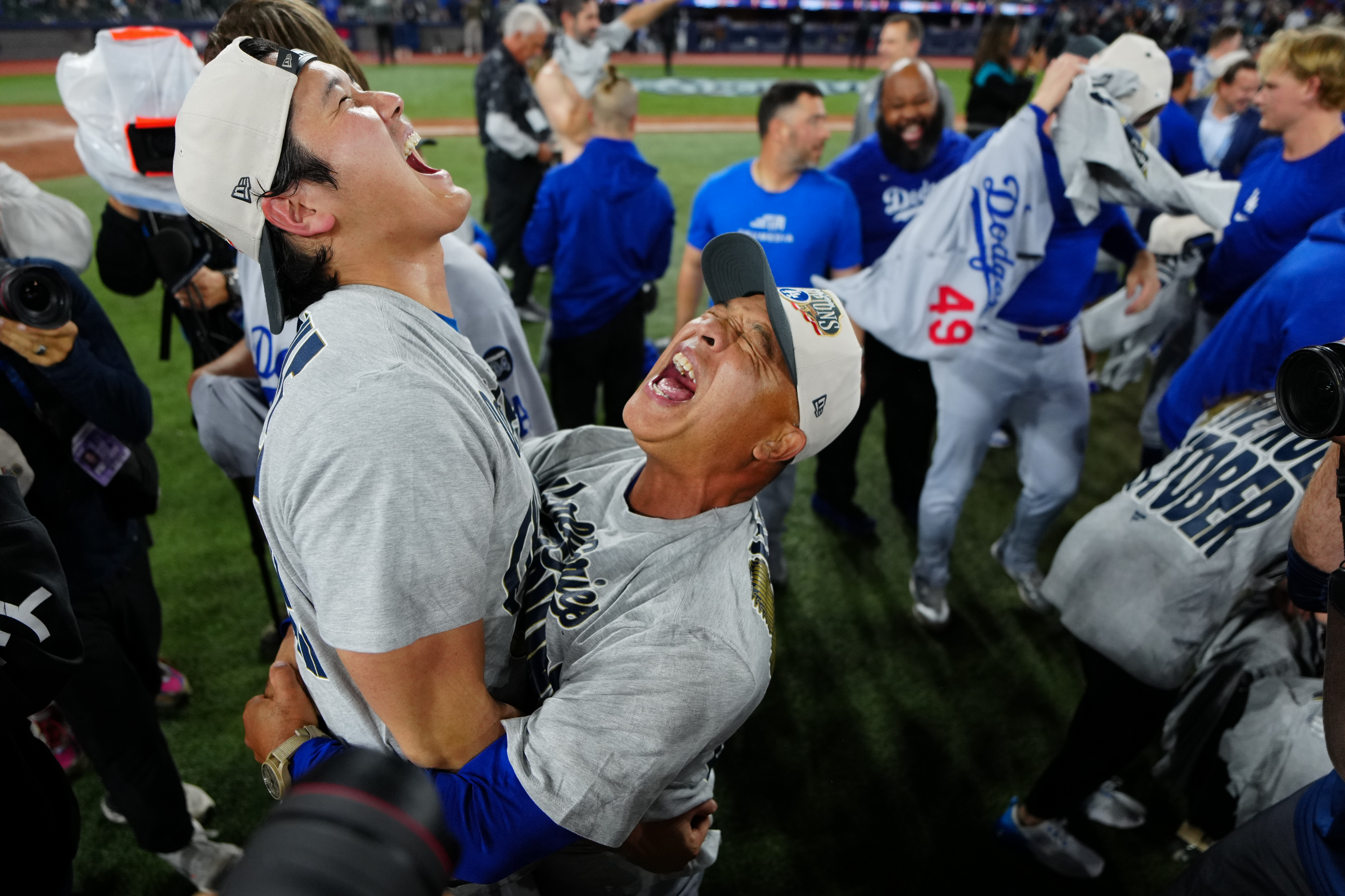 TORONTO, ON - NOVEMBER 01:   Shohei Ohtani #17 and manager Dave Roberts #30 of the Los Angeles Dodgers celebrate after winning Game Seven of the 2025 World Series presented by Capital One between the Los Angeles Dodgers and the Toronto Blue Jays at Rogers Centre on Saturday, November 1, 2025 in Toronto, Ontario, Canada. (Photo by Daniel Shirey/MLB Photos via Getty Images)
