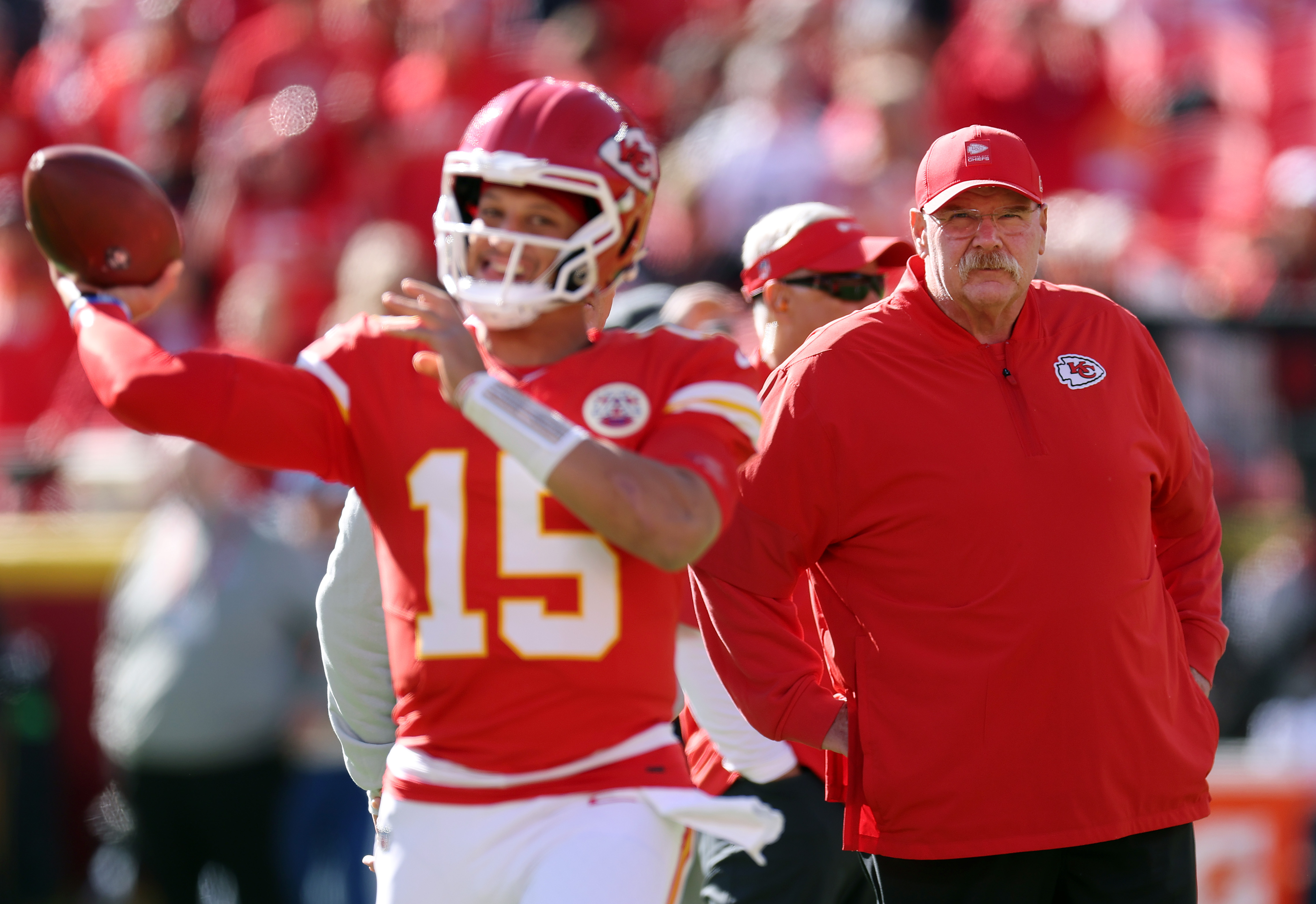 KANSAS CITY, MISSOURI - OCTOBER 19: Head coach Andy Reid of the Kansas City Chiefs watches quarterback Patrick Mahomes #15 warm up prior to the game at Arrowhead Stadium on October 19, 2025 in Kansas City, Missouri.  (Photo by Jamie Squire/Getty Images)