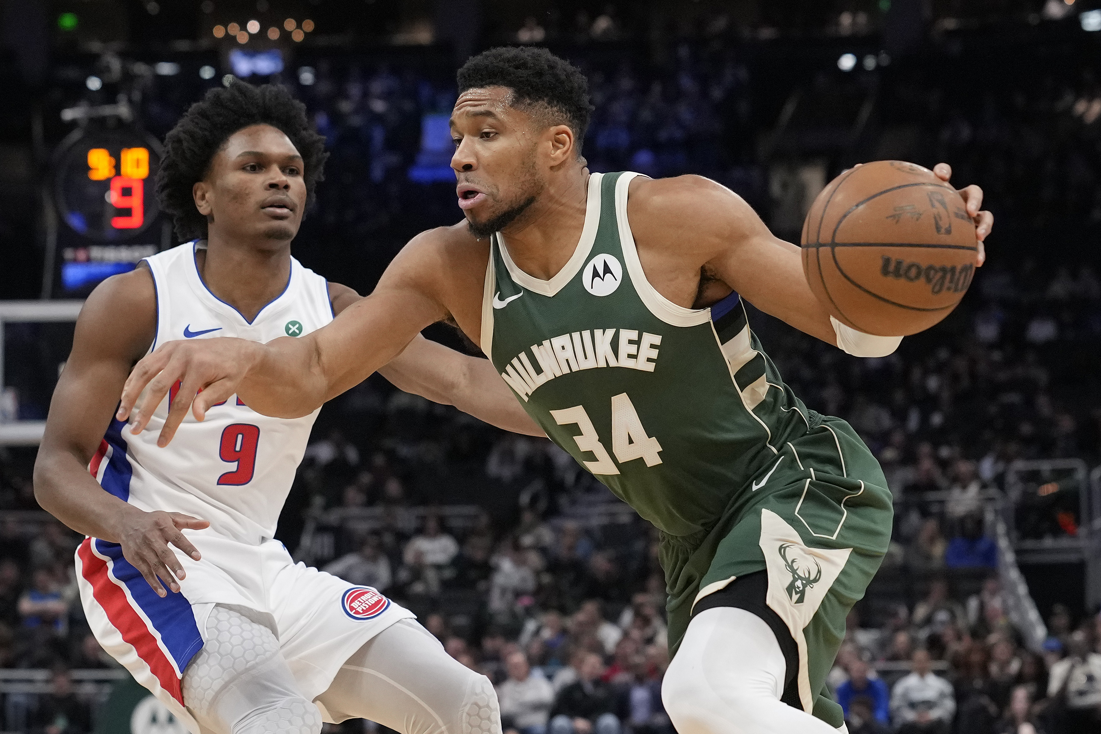 MILWAUKEE, WISCONSIN - DECEMBER 03: Giannis Antetokounmpo #34 of the Milwaukee Bucks drives against Ausar Thompson #9 of the Detroit Pistons during the first quarter at Fiserv Forum on December 03, 2025 in Milwaukee, Wisconsin. NOTE TO USER: User expressly acknowledges and agrees that, by downloading and or using this photograph, User is consenting to the terms and conditions of the Getty Images License Agreement. (Photo by Patrick McDermott/Getty Images)