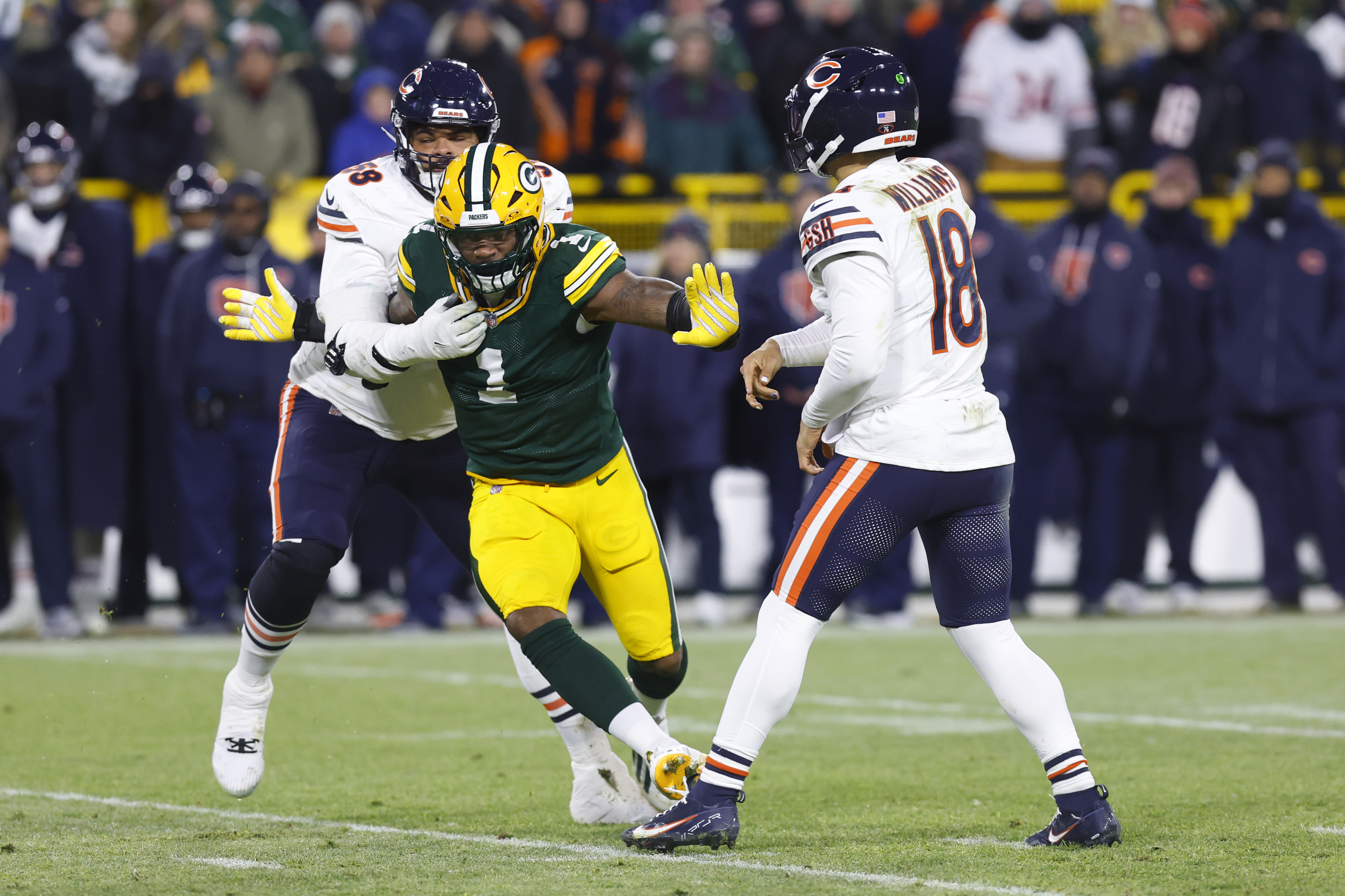 GREEN BAY, WI - DECEMBER 07: Green Bay Packers defensive end Micah Parsons (1) is held during a game between the Green Bay Packers and the Chicago Bears on December 7, 2025 at Lambeau Field, in Green Bay, WI. (Photo by Larry Radloff/Icon Sportswire via Getty Images)