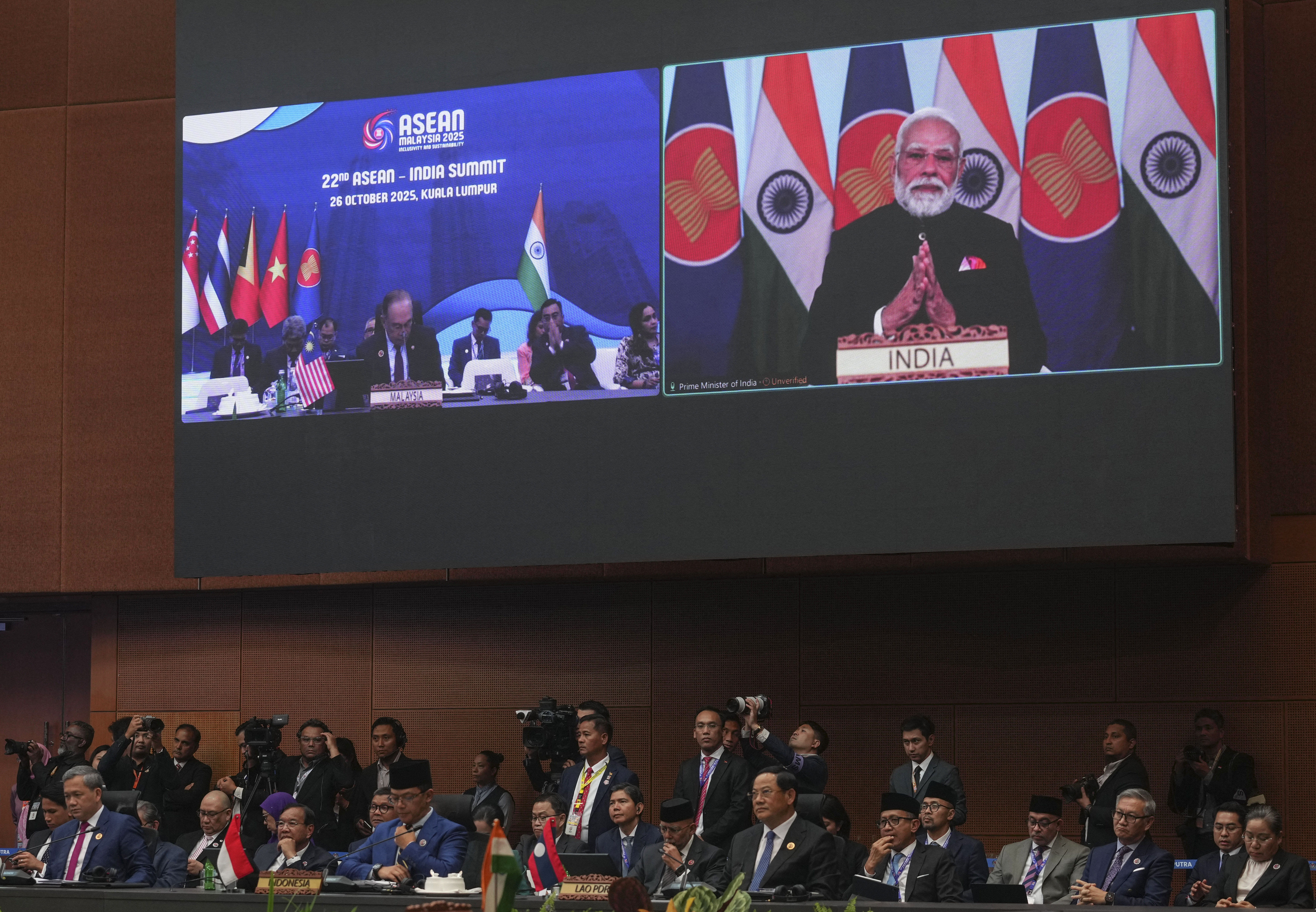 India's Prime Minister Narendra Modi appears on a screen to deliver a speech remotely as other leaders attend the 22nd ASEAN - India Summit during the 47th Association of Southeast Asian Nations (ASEAN) Summit in Kuala Lumpur on October 26, 2025. (Photo by Rafiq Maqbool / POOL / AFP) (Photo by RAFIQ MAQBOOL/POOL/AFP via Getty Images)          