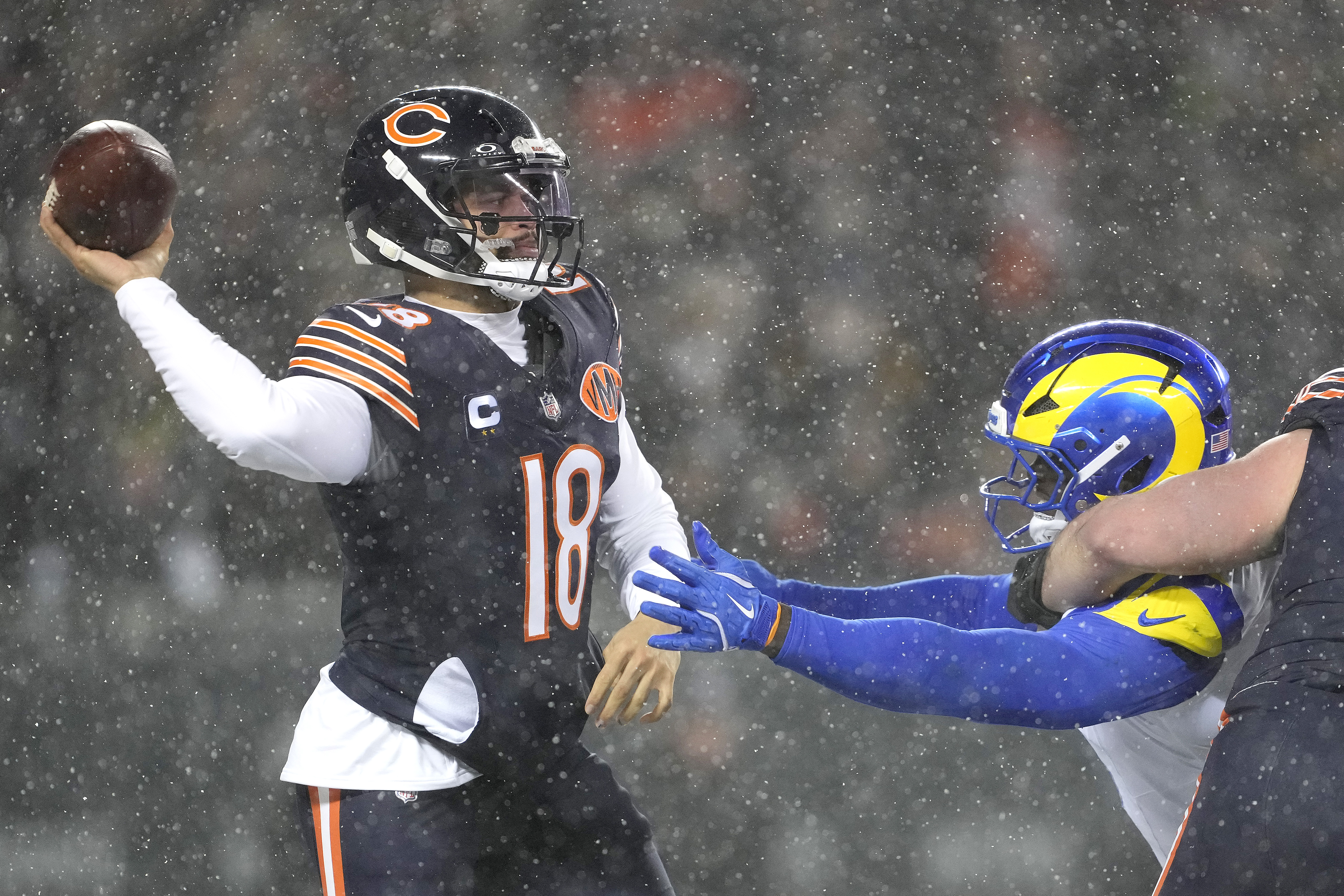 Caleb Williams' latest wild touchdown pass to force OT not enough to lift Bears past Rams in divisional round matchup