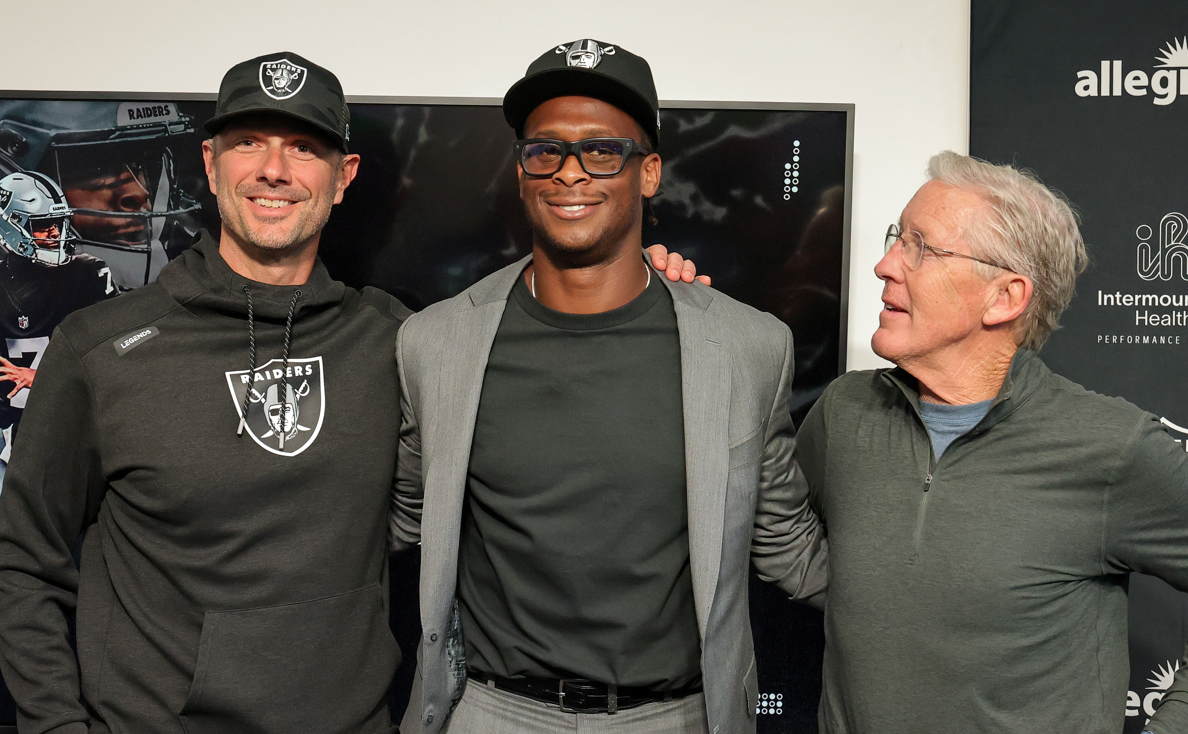 HENDERSON, NEVADA - APRIL 07: (L-R) General manager John Spytek of the Las Vegas Raiders, quarterback Geno Smith and head coach Pete Carroll of the Raiders pose after a news conference introducing Smith at the Las Vegas Raiders Headquarters/Intermountain Healthcare Performance Center on April 07, 2025 in Henderson, Nevada. (Photo by Ethan Miller/Getty Images)