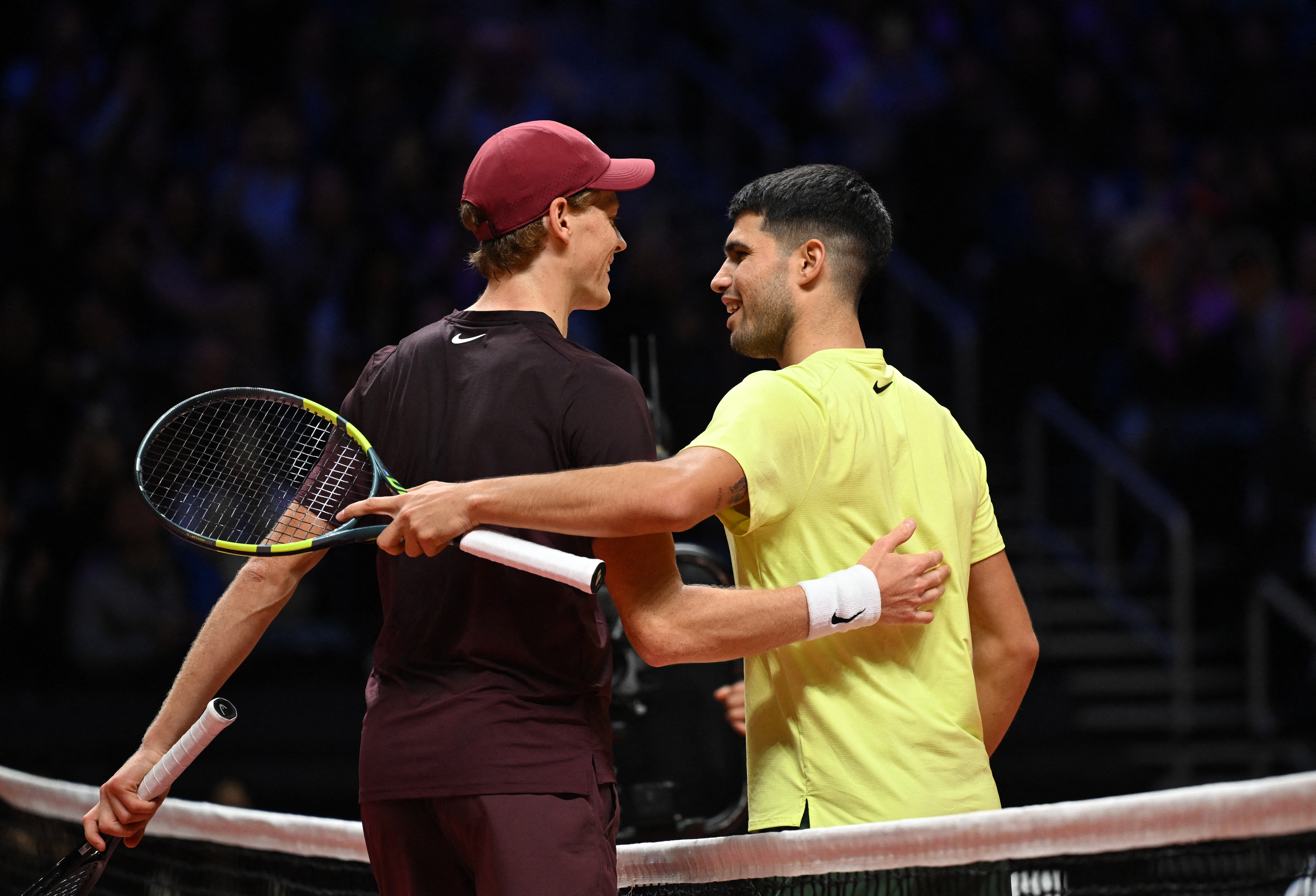 Spain's Carlos Alcaraz (R) shakes hands with Italy's Jannik Sinner (L) after their exhibition tennis match at Inspire Arena in Incheon on January 10, 2026. (Photo by Jung Yeon-je / AFP via Getty Images)