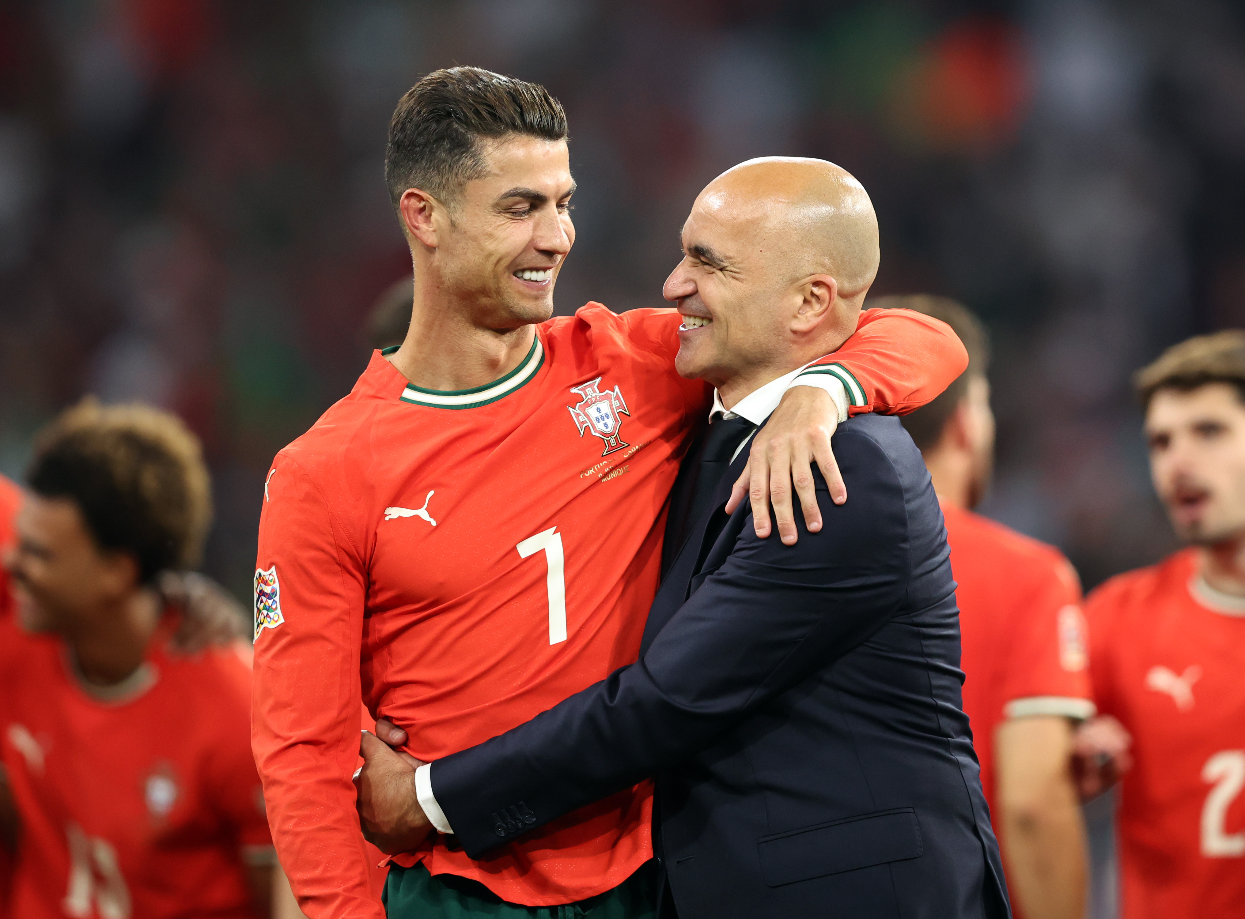 MUNICH, GERMANY - JUNE 08: Cristiano Ronaldo of Portugal celebrates victory with Roberto Martinez, Manager of Portugal, following the UEFA Nations League 2025 final match between Portugal and Spain at Munich Football Arena on June 08, 2025 in Munich, Germany. (Photo by Stefan Matzke - sampics/Getty Images)