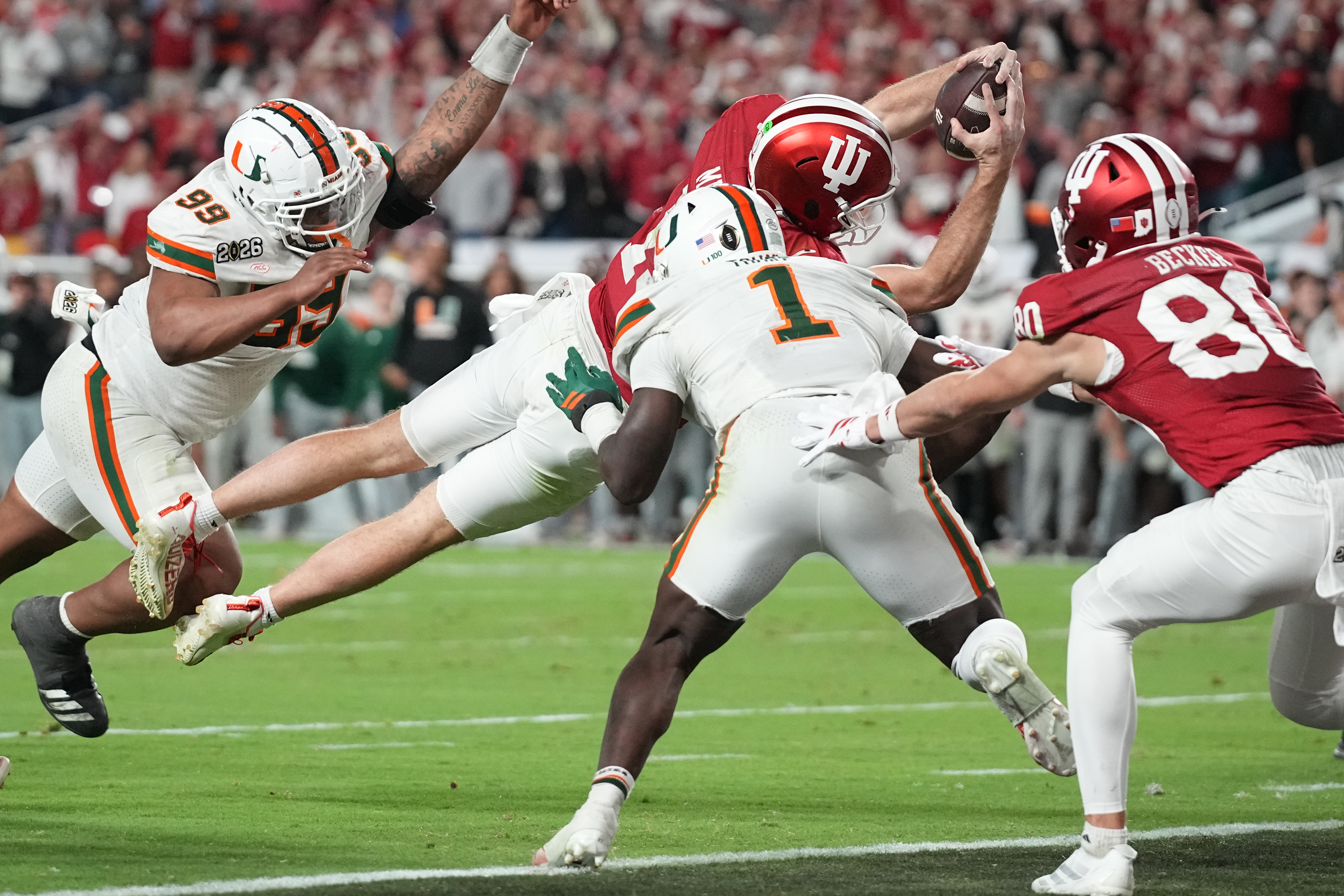 MIAMI GARDENS, FL - JANUARY 19: QB Fernando Mendoza #15 of the Indiana Hoosiers runs for a touchdown in the fourth quarter during the Indiana Hoosiers versus the Miami Hurricanes College Football Playoff National Championship Game Presented by AT&T on January 19, 2026, at Hard Rock Stadium in Miami Gardens, FL. (Photo by Peter Joneleit/Icon Sportswire via Getty Images)