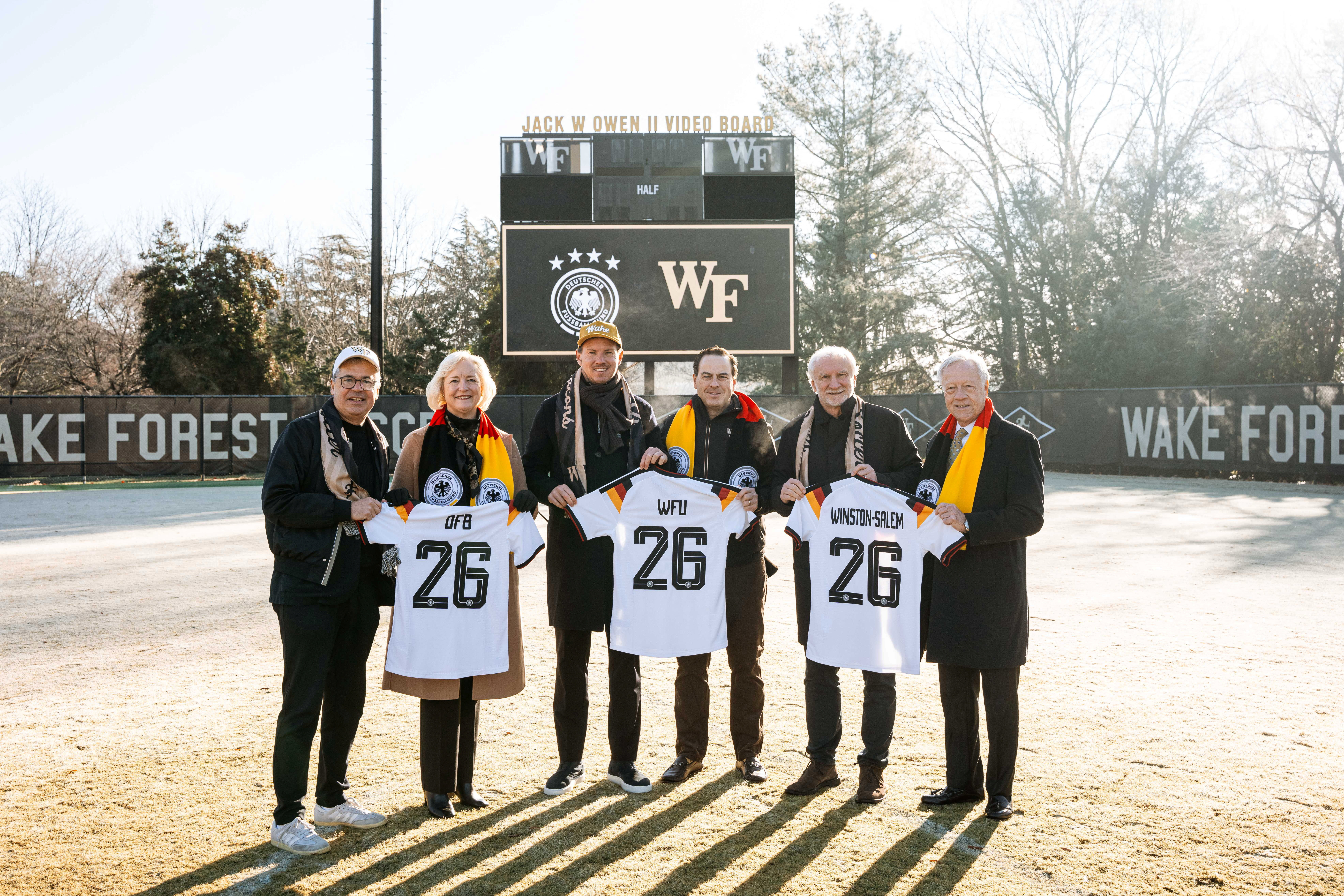 Dec 7, 2025; Winston-Salem, North Carolina, USA; Wake Forest University President Dr. Susan Wente, German head coach Julian Nagelsmann, Wake Forest University vice president and director of athletics John Currie, Director of the German national team Rudi Voller, and members of the German Football Association pose for a portrait at W. Dennie Spry Soccer Stadium. The German Football Association chose Wake Forest University as its Team Base Camp for FIFA World Cup 2026. Mandatory Credit: Wake Forest University via Imagn Images