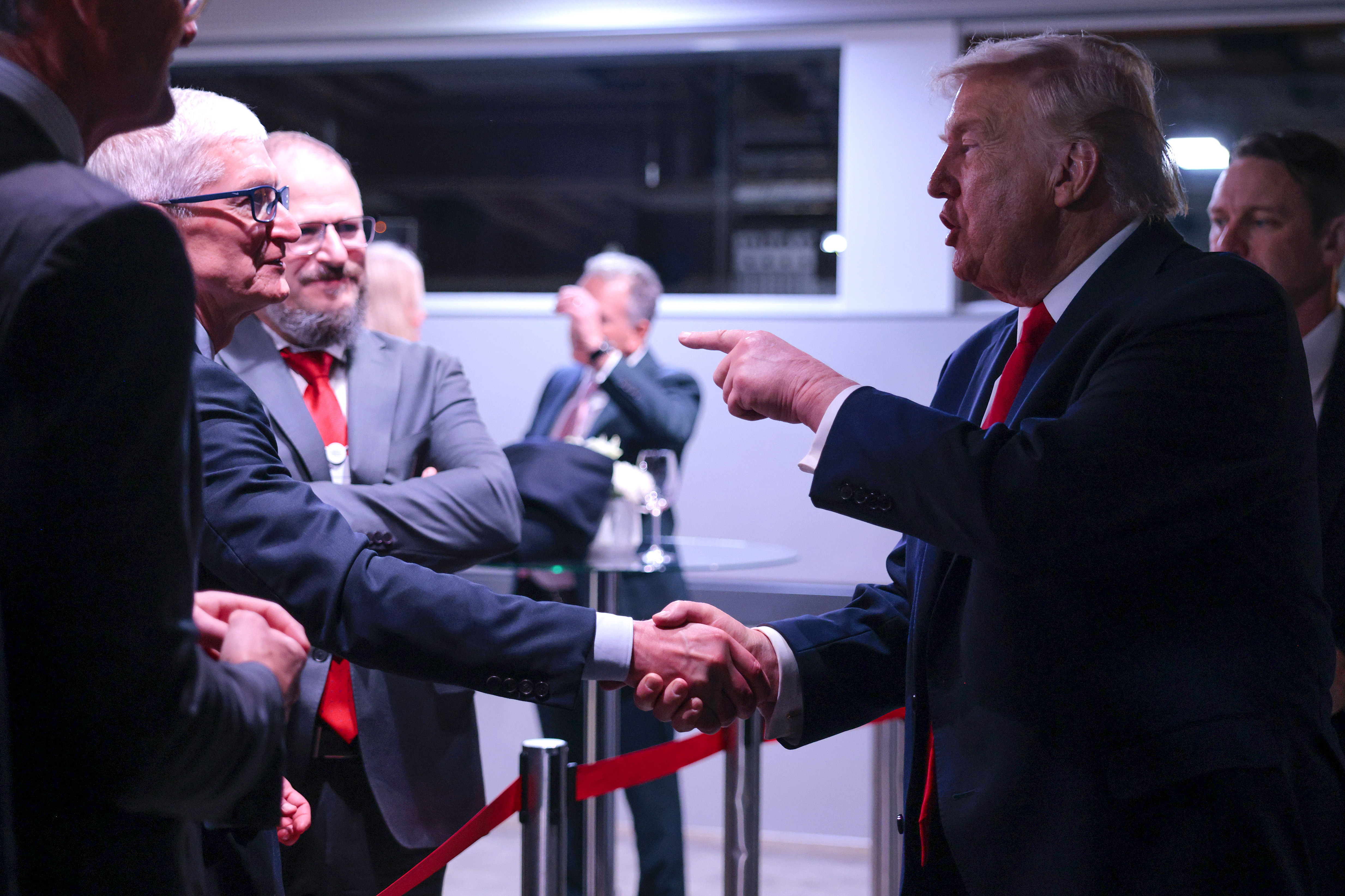 DAVOS, SWITZERLAND - JANUARY 21: U.S. President Donald Trump (R) speaks to Apple CEO Tim Cook (L) as he attends a reception for business leaders at the&nbsp;World Economic Forum (WEF) Annual Meeting on January 21, 2026 in Davos, Switzerland. The annual meeting of political and business leaders comes amid rising tensions between the United States and Europe over a range of issues, including Trump's vow to acquire Greenland, a semi-autonomous Danish territory. (Photo by Chip Somodevilla/Getty Images)