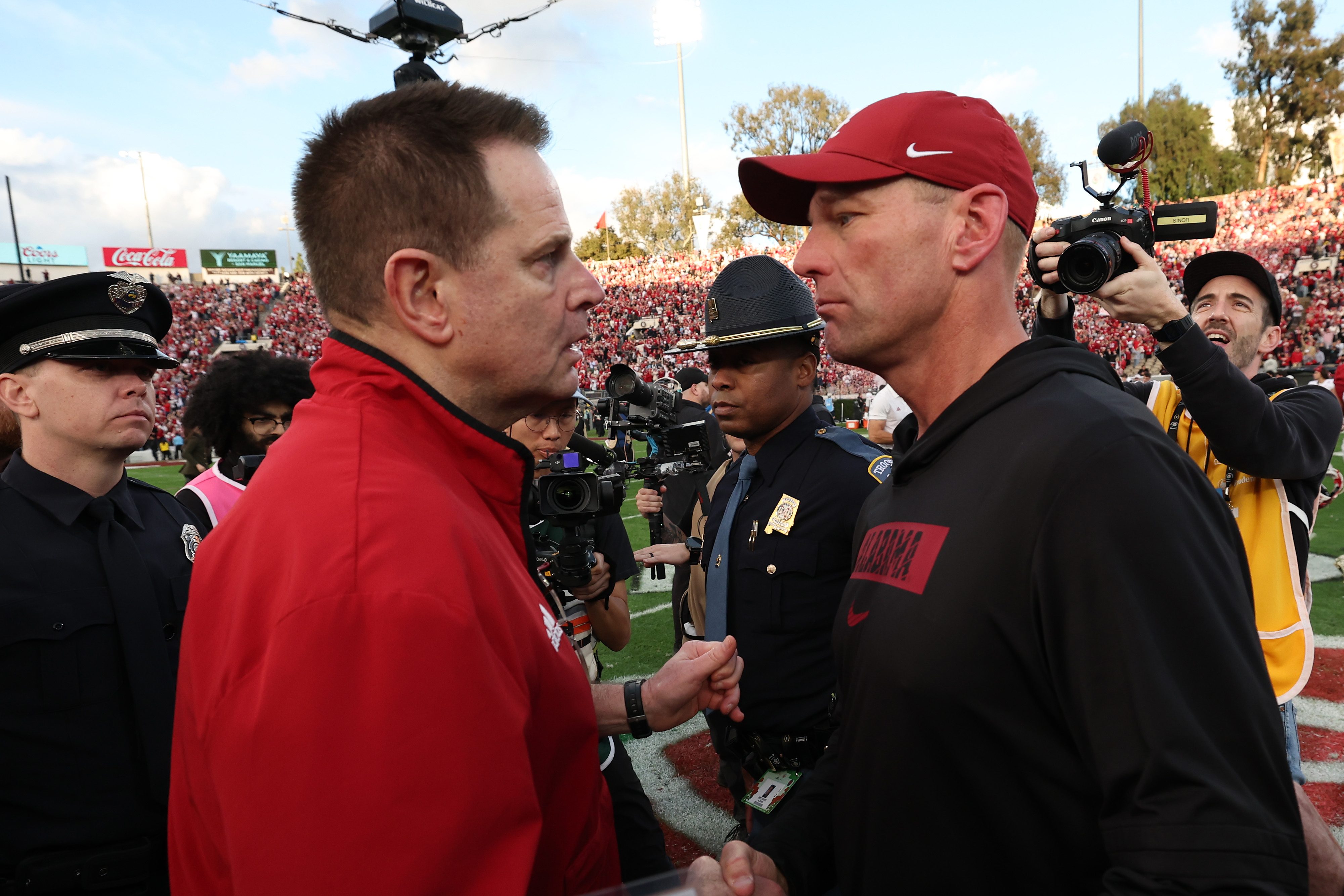 PASADENA, CALIFORNIA - JANUARY 01: Head coach Curt Cignetti of the Indiana Hoosiers and head coach Kalen Deboer of the Alabama Crimson Tide embrace after the game in the College Football Playoff Quarterfinal at Rose Bowl Stadium on January 01, 2026 in Pasadena, California. (Photo by Luke Hales/Getty Images)