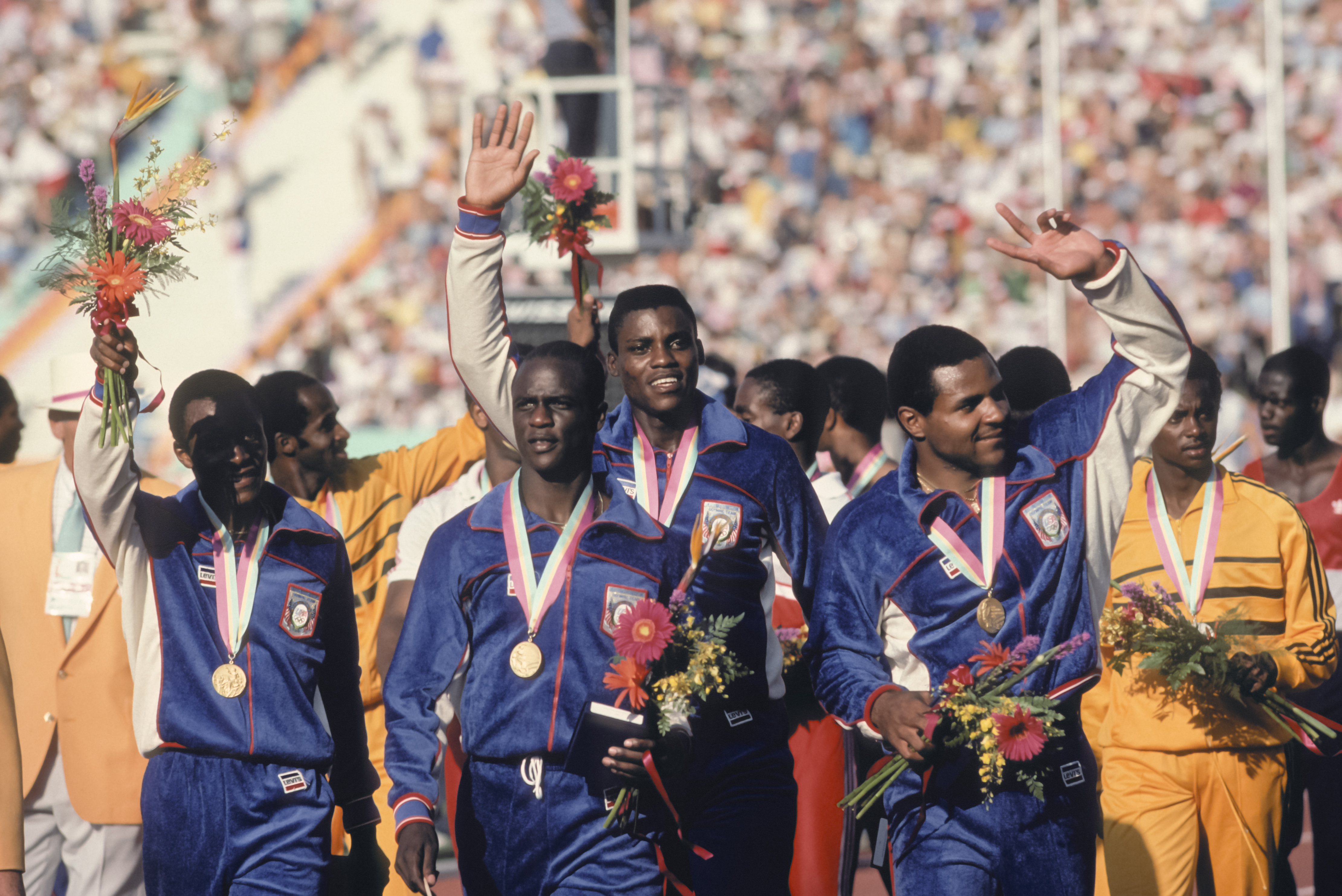 Sam Graddy (second U.S. sprinter from left) and Ron Brown (right) were both part of the United States' gold medalist 4x100-meter relay squad. (Photo by David Madison/Getty Images)