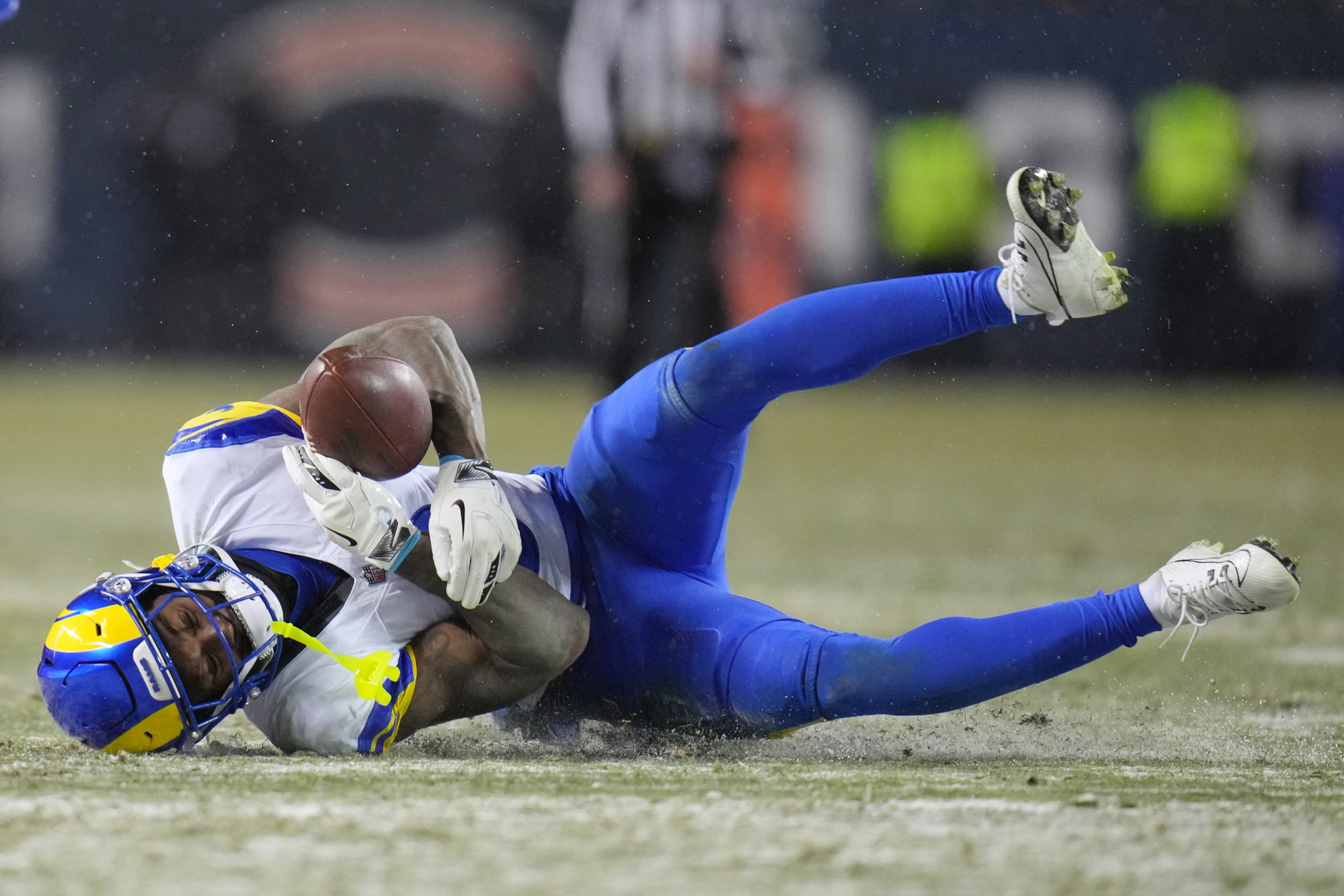 Los Angeles Rams safety Kam Curl makes an interception on a pass by Chicago Bears quarterback Caleb Williams, not visible, during overtime of an NFL football divisional playoff game Sunday, Jan. 18, 2026, in Chicago. (AP Photo/Jeff Roberson)