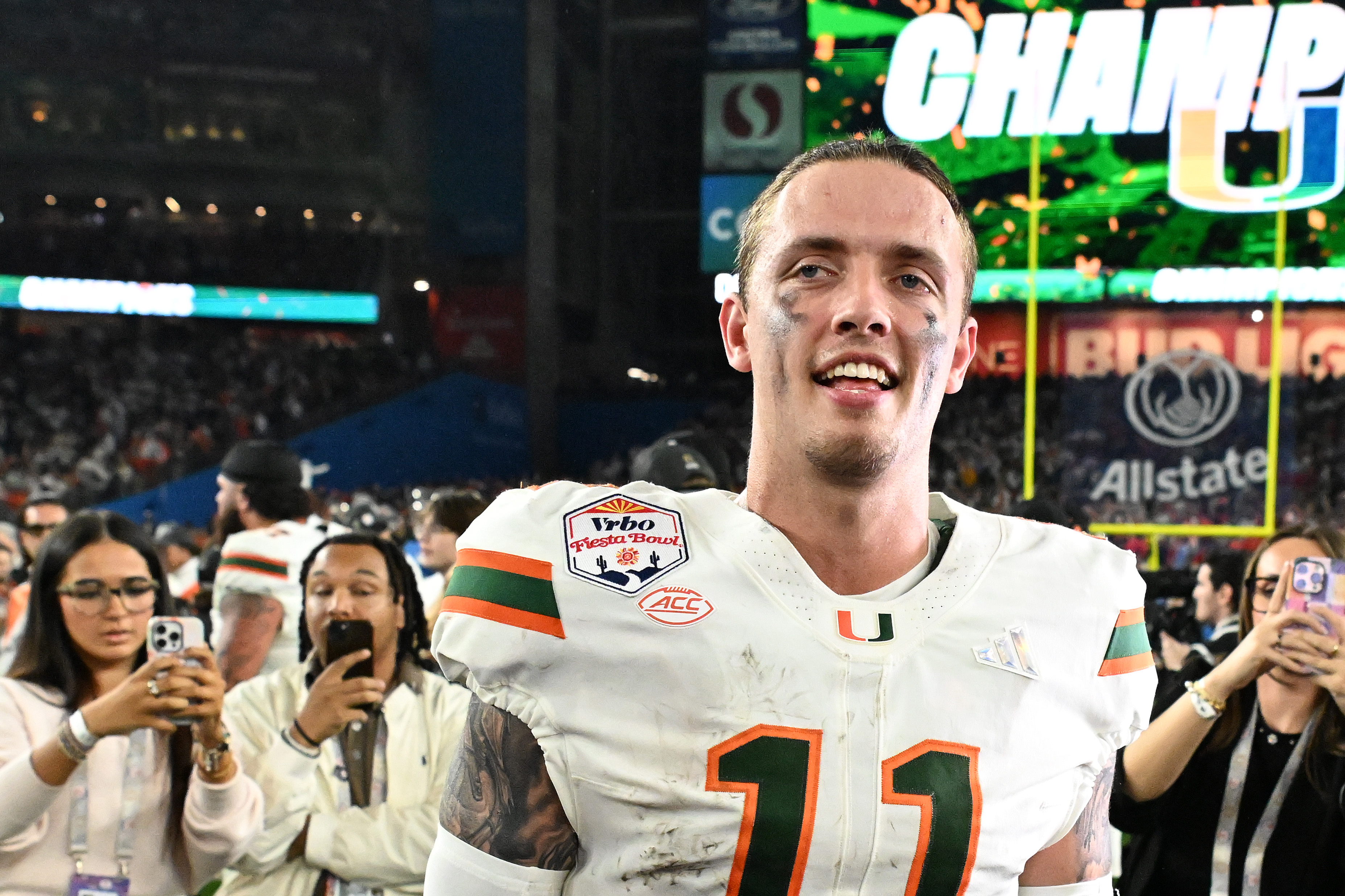 GLENDALE, ARIZONA - JANUARY 08: Carson Beck #11 of the Miami Hurricanes reacts after the game against the Ole Miss Rebels during the 2025 College Football Playoff Semifinal at the VRBO Fiesta Bowl at State Farm Stadium on January 08, 2026 in Glendale, Arizona. The Hurricanes defeated the Rebels 31-27. (Photo by Norm Hall/Getty Images)