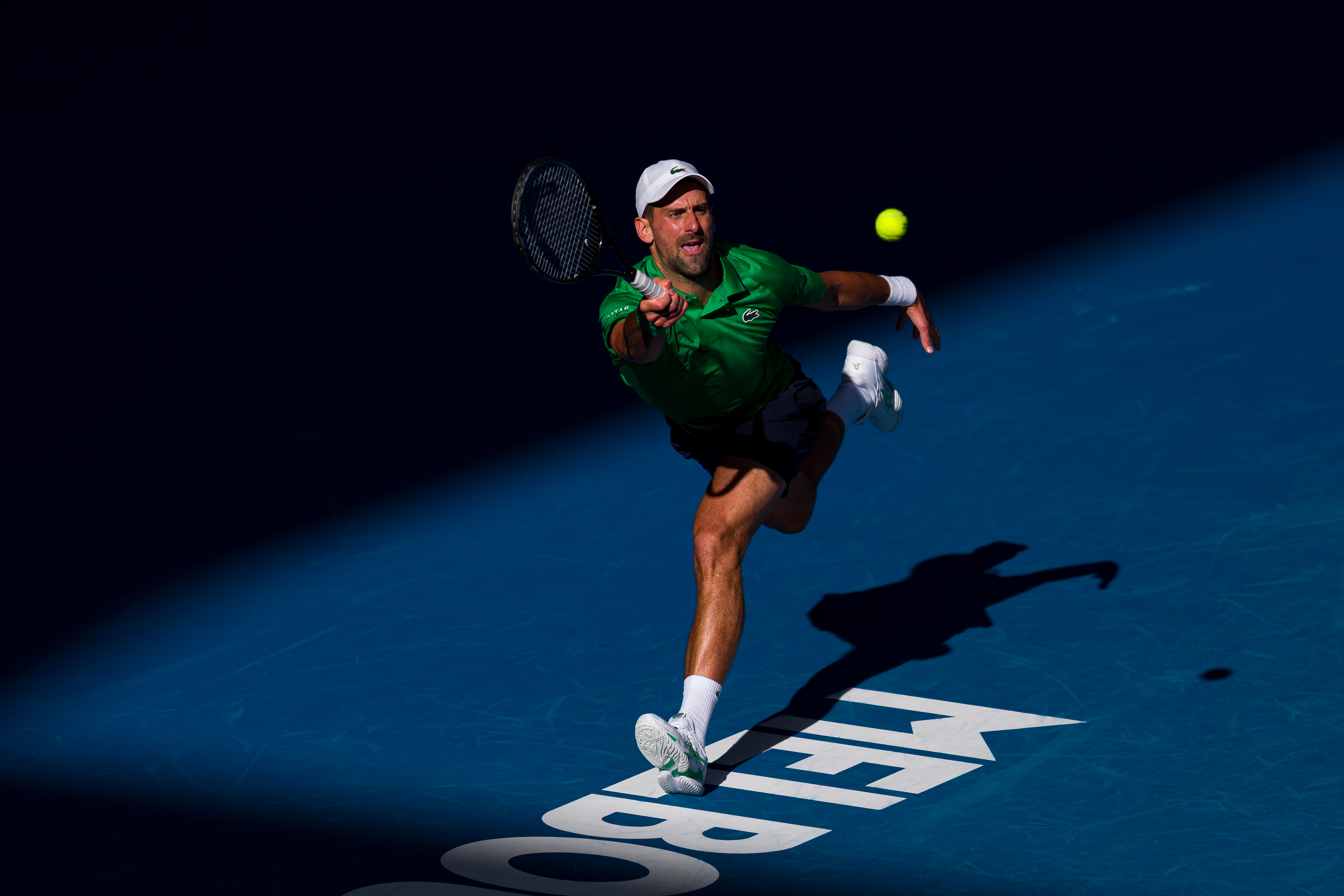 MELBOURNE, AUSTRALIA - JANUARY 15: Novak Djokovic of Serbia plays a forehand in his opening week showdown match against Frances Tiafoe of the United States ahead of the 2026 Australian Open at Melbourne Park on January 15, 2026 in Melbourne, Australia. (Photo by Andy Cheung/Getty Images)