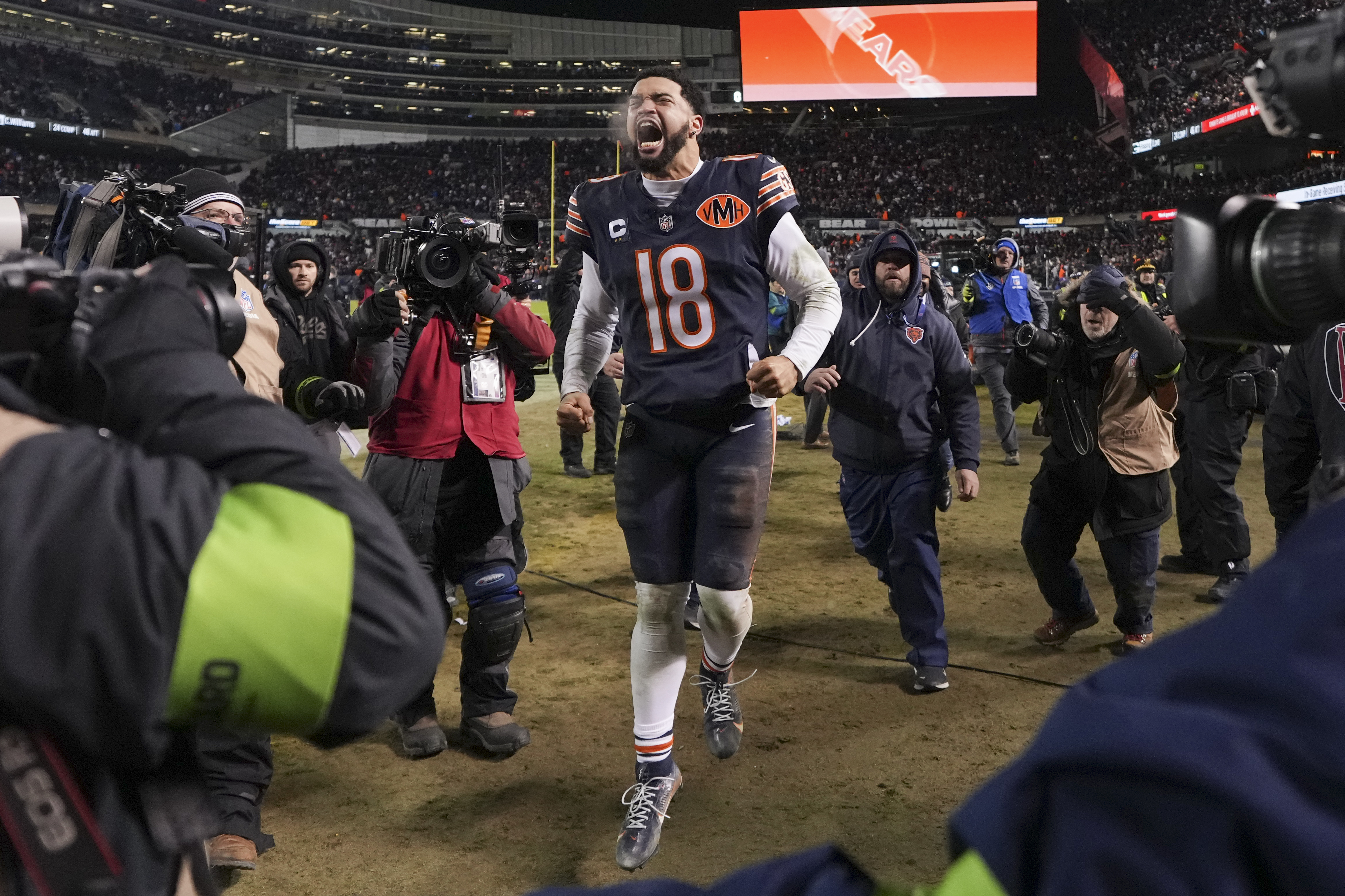 CHICAGO, ILLINOIS - JANUARY 10: Caleb Williams #18 of the Chicago Bears celebrates after an NFL Wild Card game against the Green Bay Packers at Solider Field on January 10, 2026 in Chicago, Illinois. (Photo by Todd Rosenberg/Getty Images)