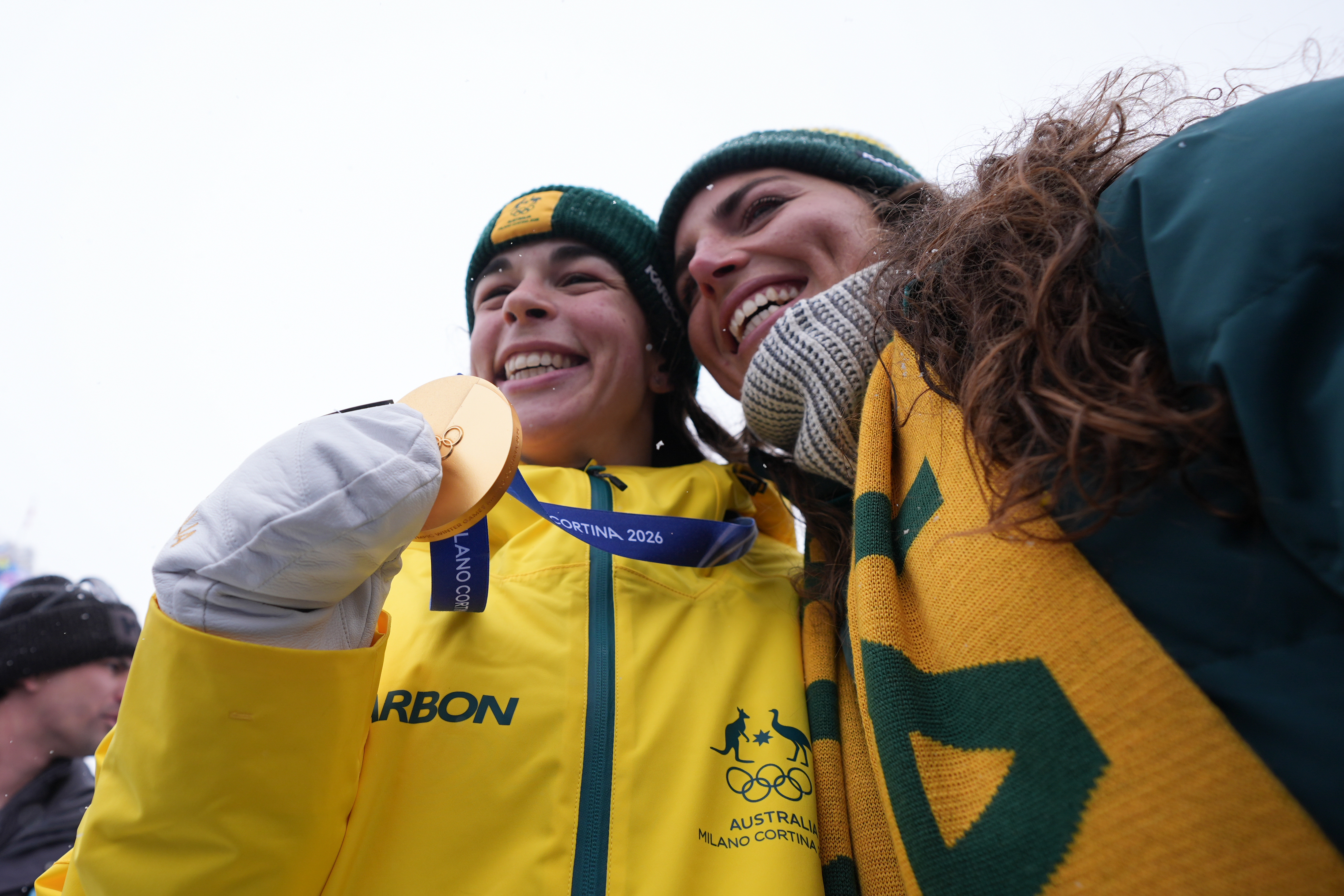 Gold medalist Australia's Jakara Anthony, left, celebrates with Australian Olympian Jessica Fox after the women's freestyle skiing dual moguls finals at the 2026 Winter Olympics, in Livigno, Italy, Saturday, Feb. 14, 2026. (AP Photo/Lindsey Wasson)