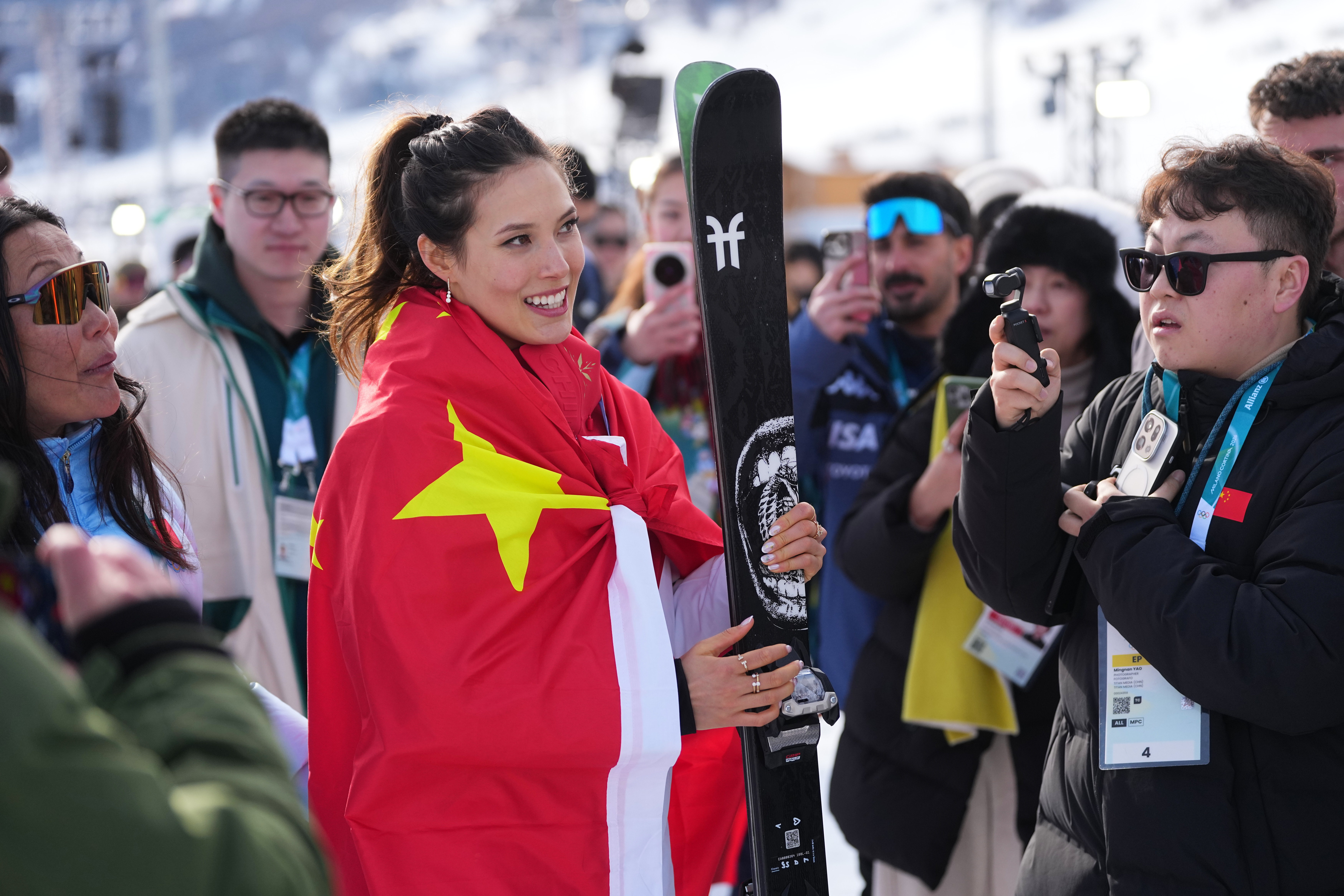 Eileen Gu wears a China flag after winning silver in women's freestyle skiing slopestyle. (AP Photo/Lindsey Wasson)