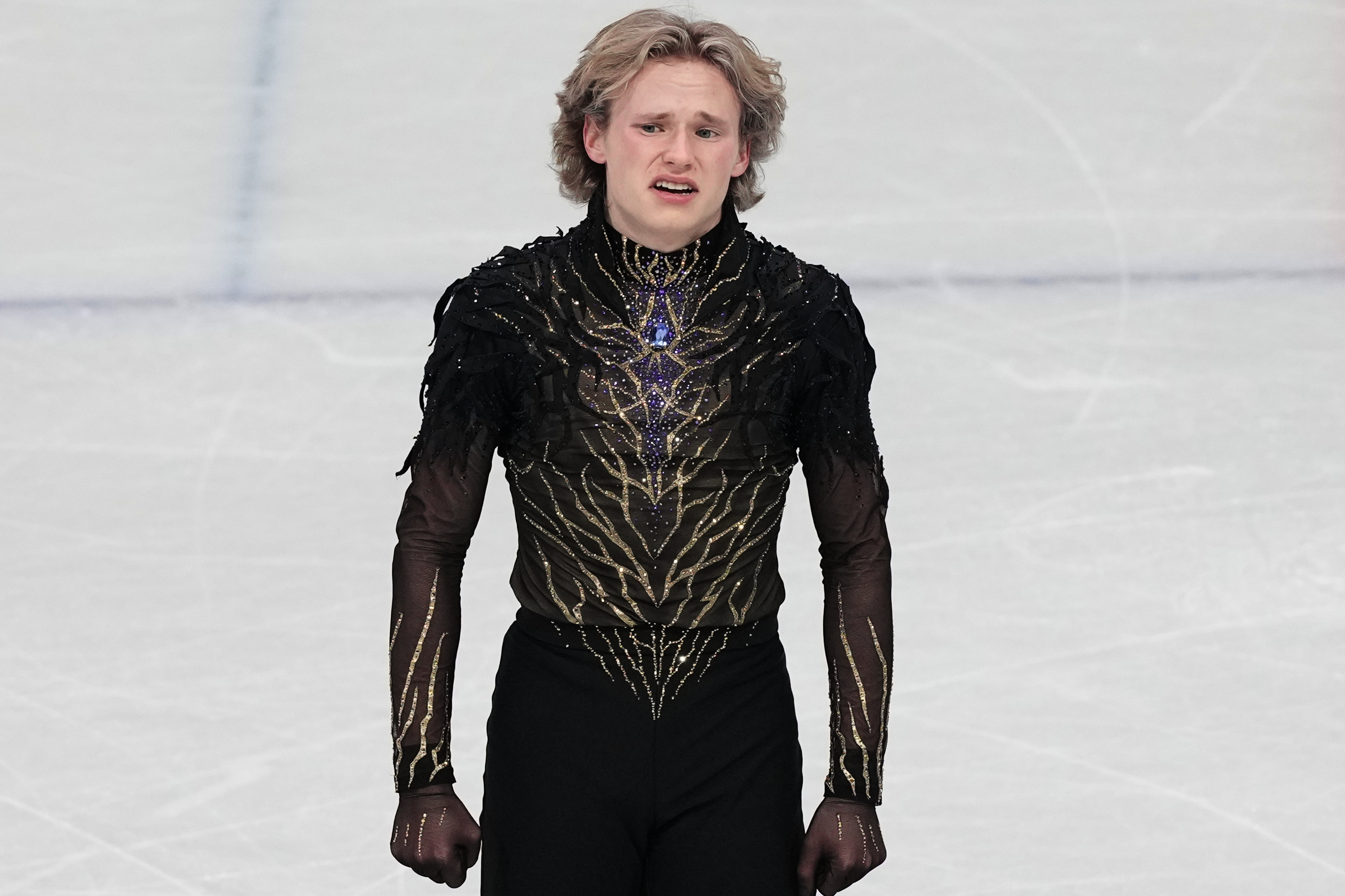Ilia Malinin of the United States reacts at the end of his program after competing during the men's free skate program in figure skating at the 2026 Winter Olympics, in Milan, Italy, Friday, Feb. 13, 2026. (AP Photo/Francisco Seco)
