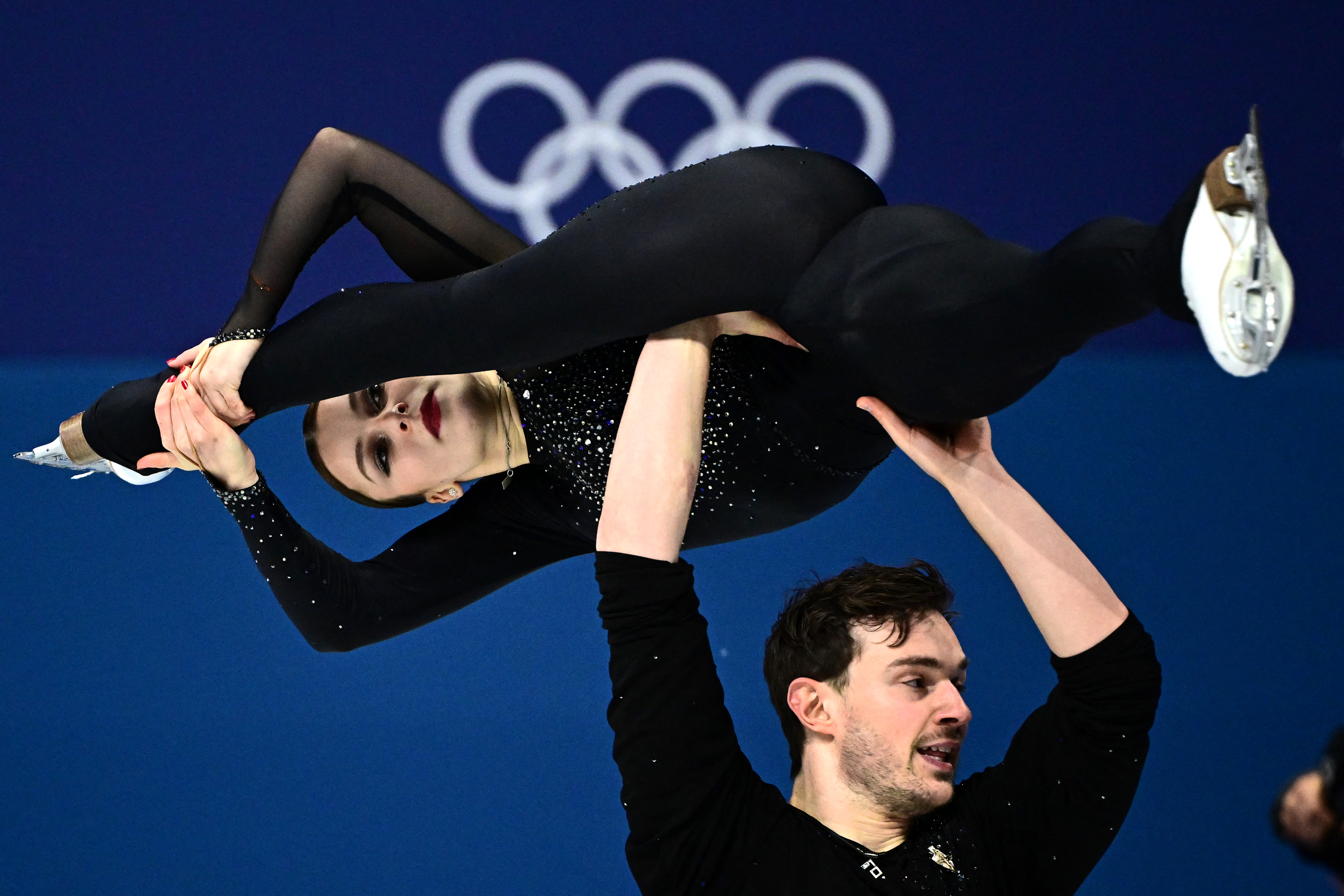 Netherlands' Daria Danilova and Netherlands' Michel Tsiba compete in the figure skating pair skating short program during the Milano Cortina 2026 Winter Olympic Games at Milano Ice Skating Arena in Milan on February 15, 2026. (Photo by JULIEN DE ROSA / AFP via Getty Images)