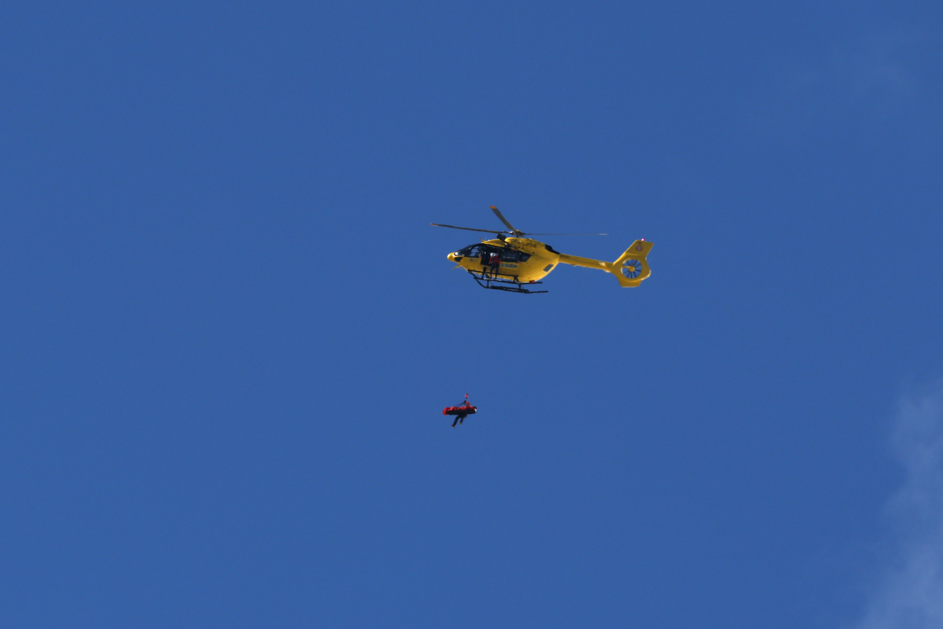 CORTINA D'AMPEZZO, ITALY - FEBRUARY 08: A mountain rescue helicopter is seen rescuing Lindsey Vonn of Team United States after she crashed during the Women's Downhill on day two of the Milano Cortina 2026 Winter Olympics at Tofane Alpine Skiing Centre on February 08, 2026 in Cortina d'Ampezzo, Italy. (Photo by Al Bello/Getty Images)