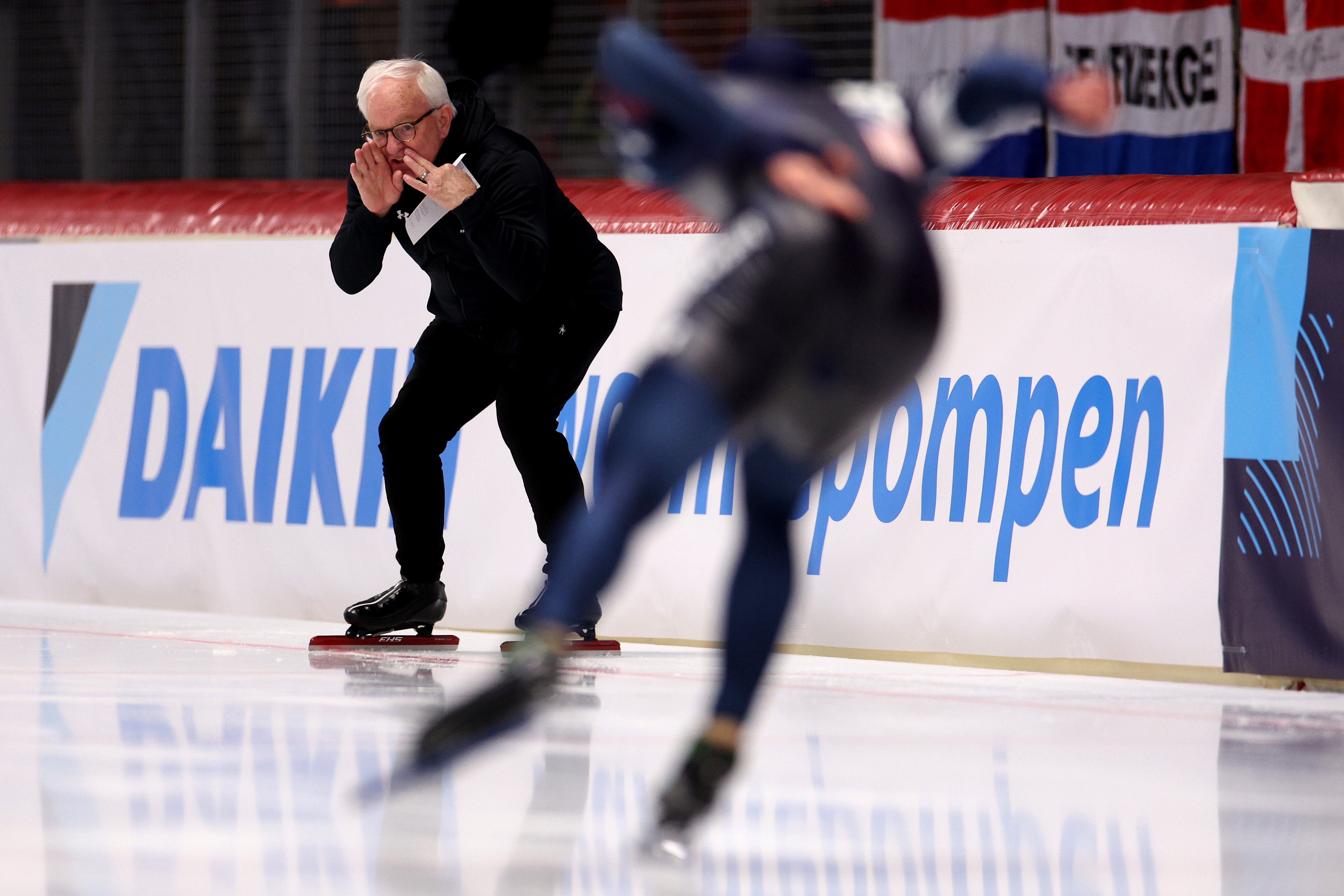 INZELL, GERMANY - MARCH 10: : Jordan Stolz of USA is given instructions on the track by his coach Bob Corby as he competes and wins the 1500m Men AllRound race during the ISU World Speed Skating Allround and Sprint Championships at Max Aicher Arena on March 10, 2024 in Inzell, Germany. (Photo by Dean Mouhtaropoulos - International Skating Union/International Skating Union via Getty Images)