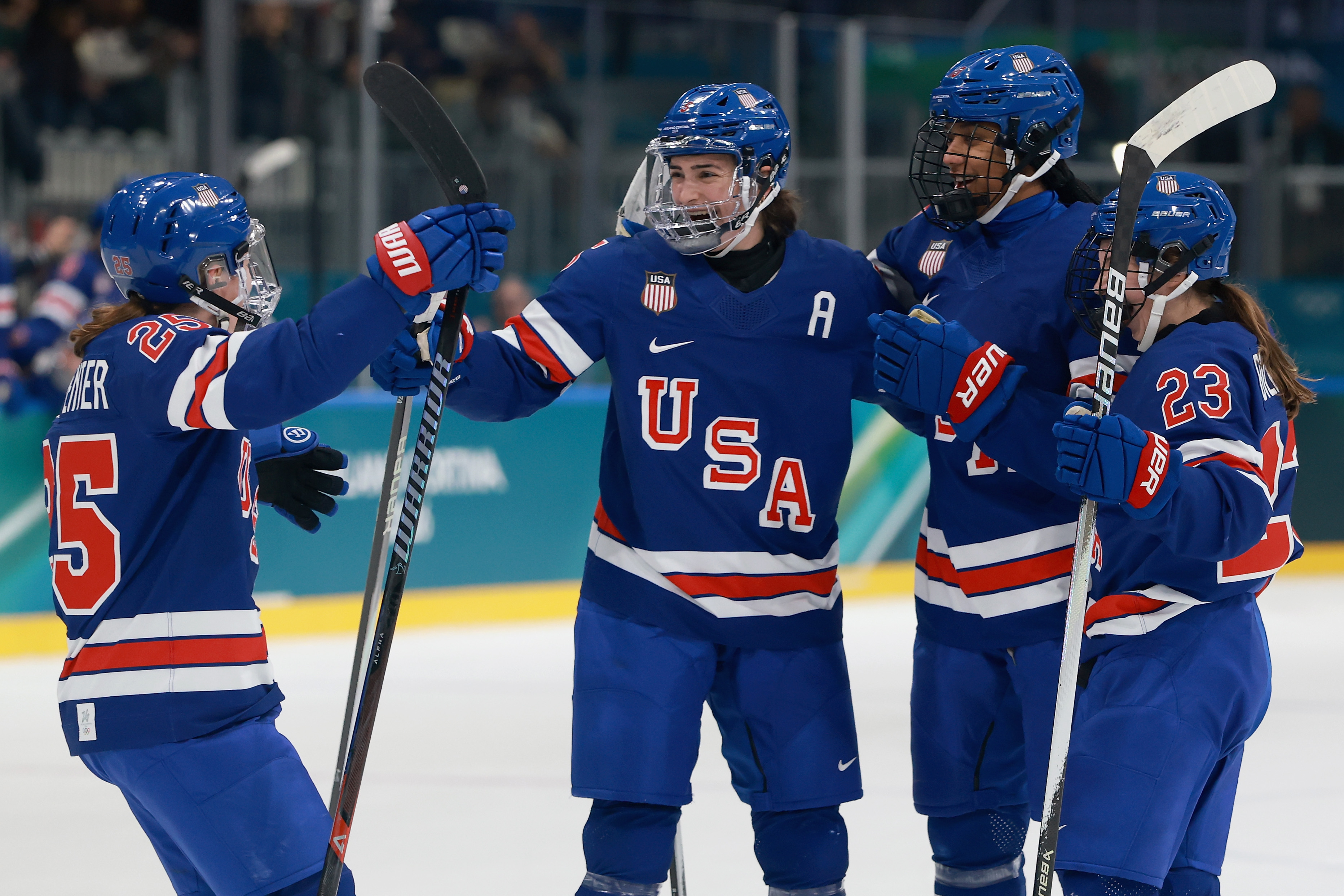 MILAN, ITALY - FEBRUARY 13: Megan Keller #5 of Team United States celebrates a goal with teammates in the first period during the Women's Quarterfinals match between the United States and Italy on day seven of the Milano Cortina 2026 Winter Olympic games at Milano Rho Ice Hockey Arena on February 13, 2026 in Milan, Italy. (Photo by Elsa/Getty Images)