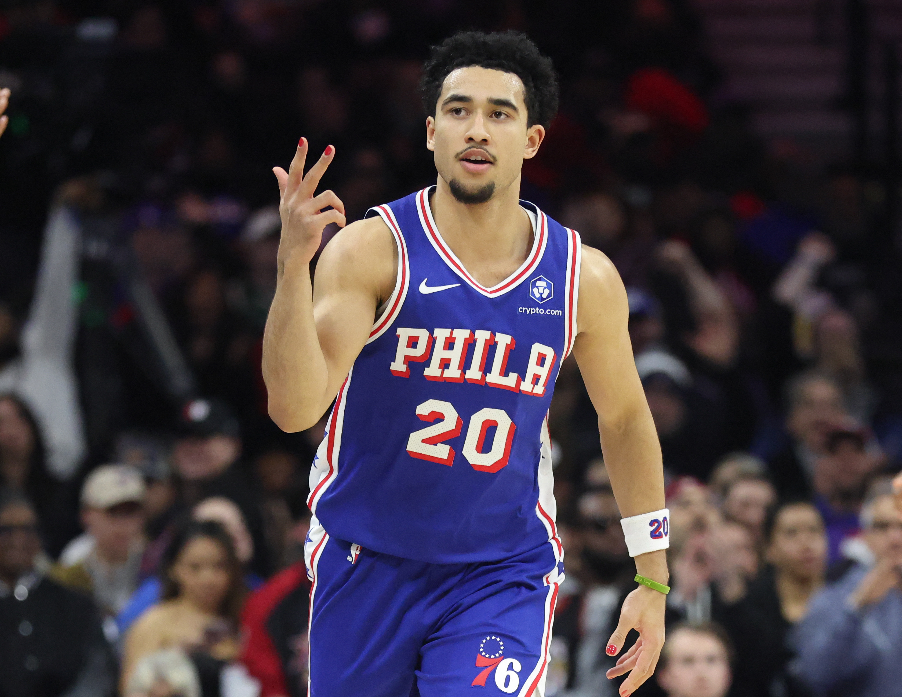 Jan 27, 2026; Philadelphia, Pennsylvania, USA; Philadelphia 76ers guard Jared McCain (20) reacts to his three pointer against the Milwaukee Bucks during the first quarter at Xfinity Mobile Arena. Mandatory Credit: Bill Streicher-Imagn Images