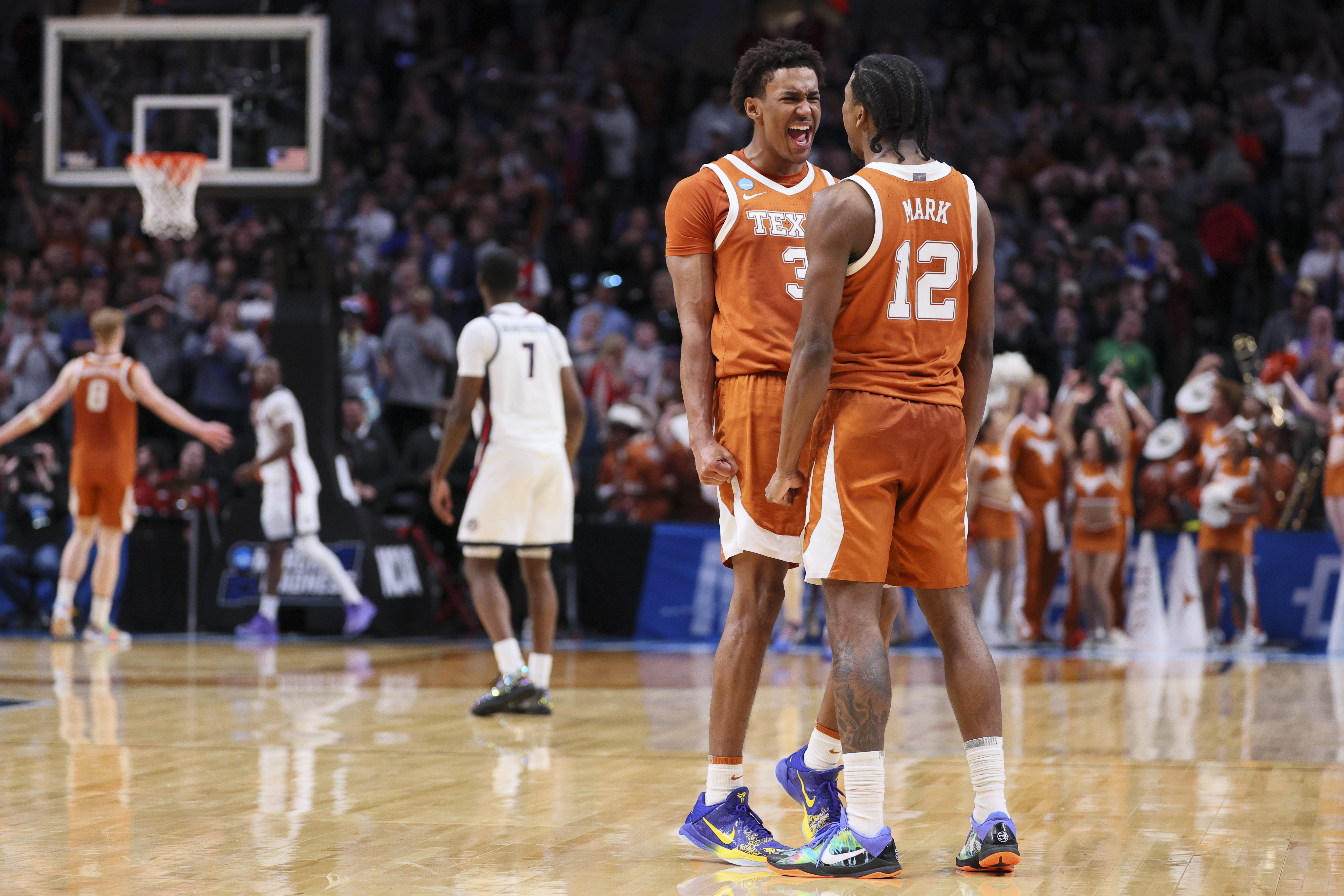PORTLAND, OREGON - MARCH 21: Dailyn Swain #3 of the Texas Longhorns and Tramon Mark #12 of the Texas Longhorns react after upsetting the Gonzaga Bulldogs during the second round of the 2026 NCAA Men's Basketball Tournament held at Moda Center on March 21, 2026 in Portland, Oregon. (Photo by C. Morgan Engel/NCAA Photos via Getty Images)