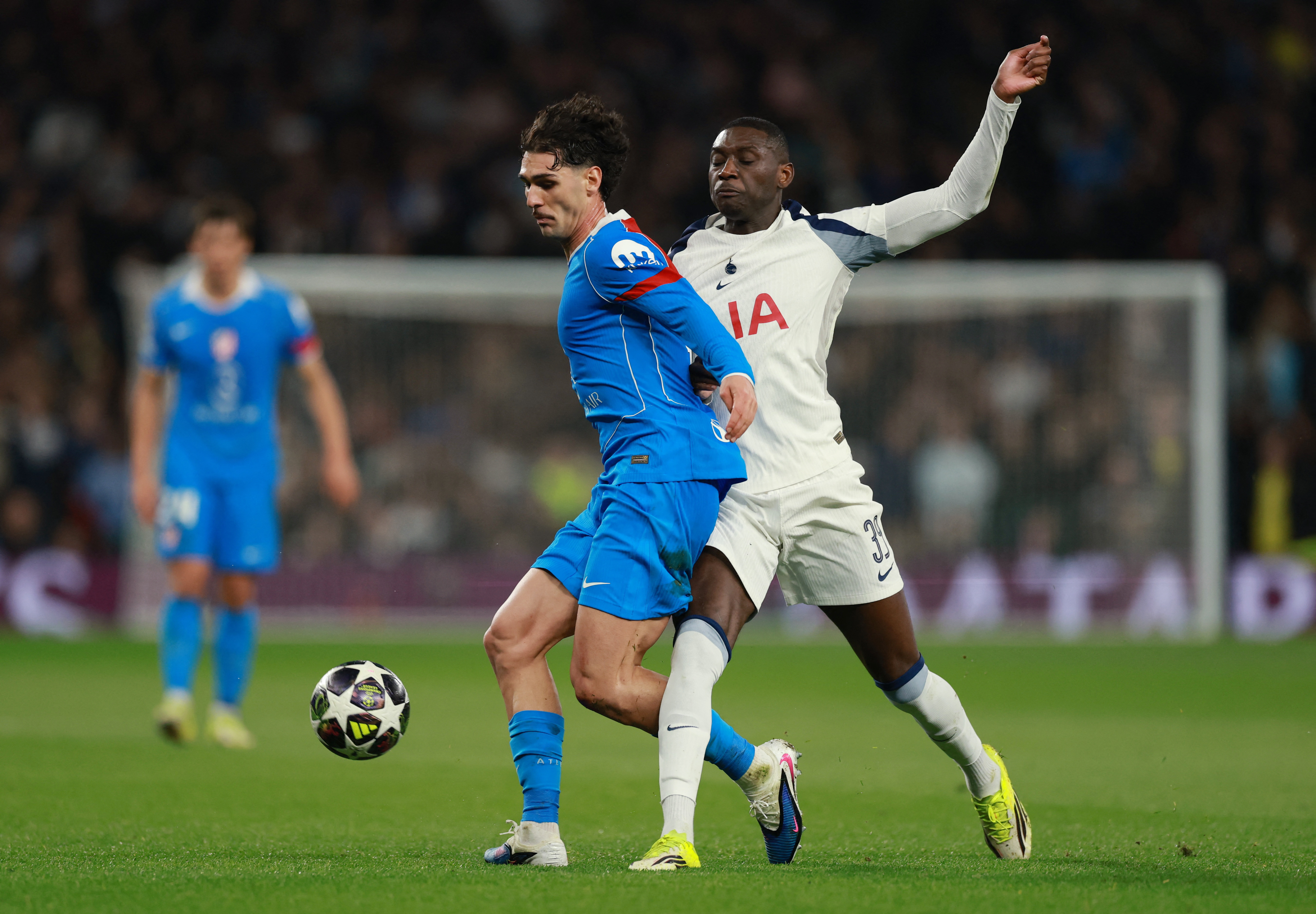 Soccer Football - UEFA Champions League - Round 16 - Second Leg - Tottenham Hotspur v Atletico Madrid - Tottenham Hotspur Stadium, London, Britain - March 18, 2026 Atletico Madrid's Johnny Cardoso in action with Tottenham Hotspur's Randal Kolo Muani Action Images via Reuters/Paul Childs