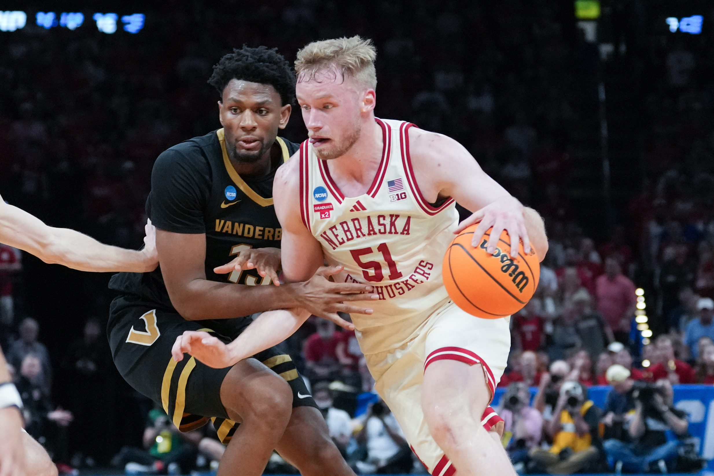 Nebraska forward Rienk Mast, right, drives past Vanderbilt center Jalen Washington, left, during the first half in the second round of the NCAA college basketball tournament Saturday, March 21, 2026, in Oklahoma City. (AP Photo/Kyle Phillips)