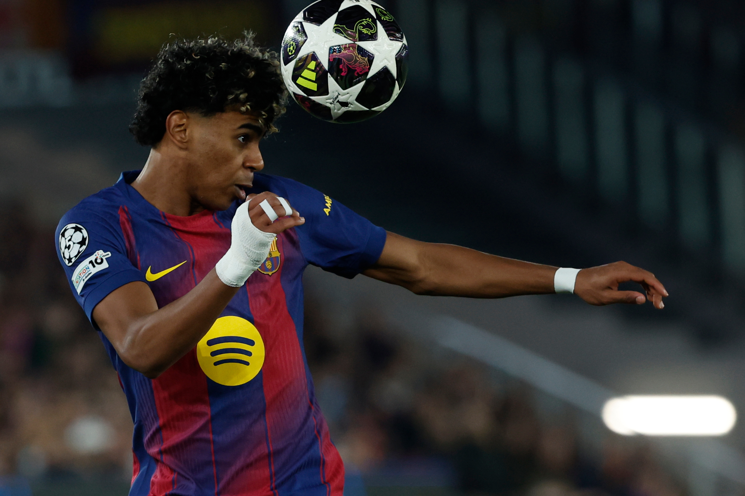 Barcelona's Lamine Yamal heads the ball during the Champions League round of 16, second leg soccer match between FC Barcelona and Newcastle United FC in Barcelona, Spain, Wednesday, March 18, 2026. (AP Photo/Joan Monfort)