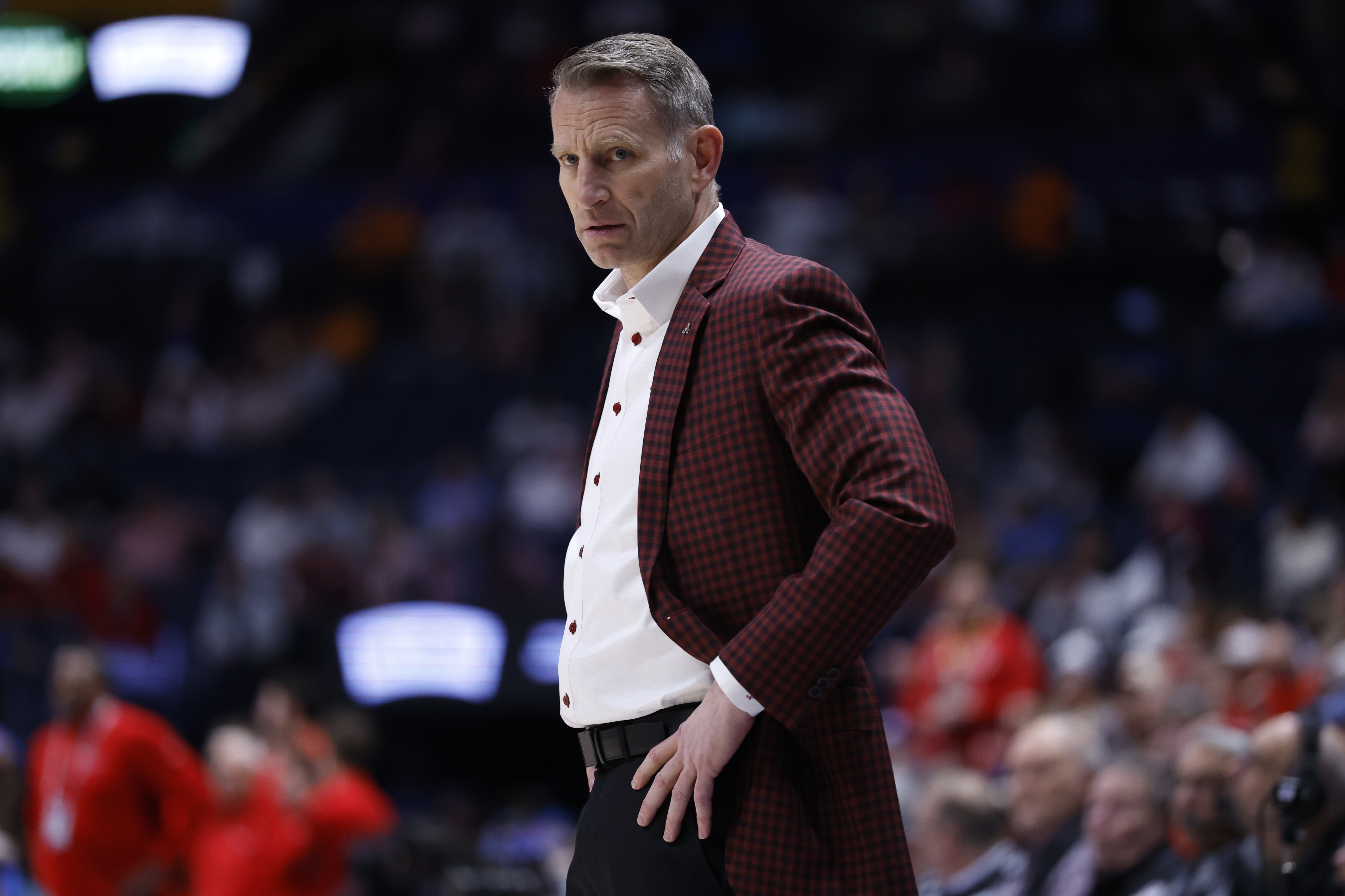 Nate Oats, who's still coaching Alabama in the NCAA tournament, said he's happy at his job when asked about the UNC vacancy. 