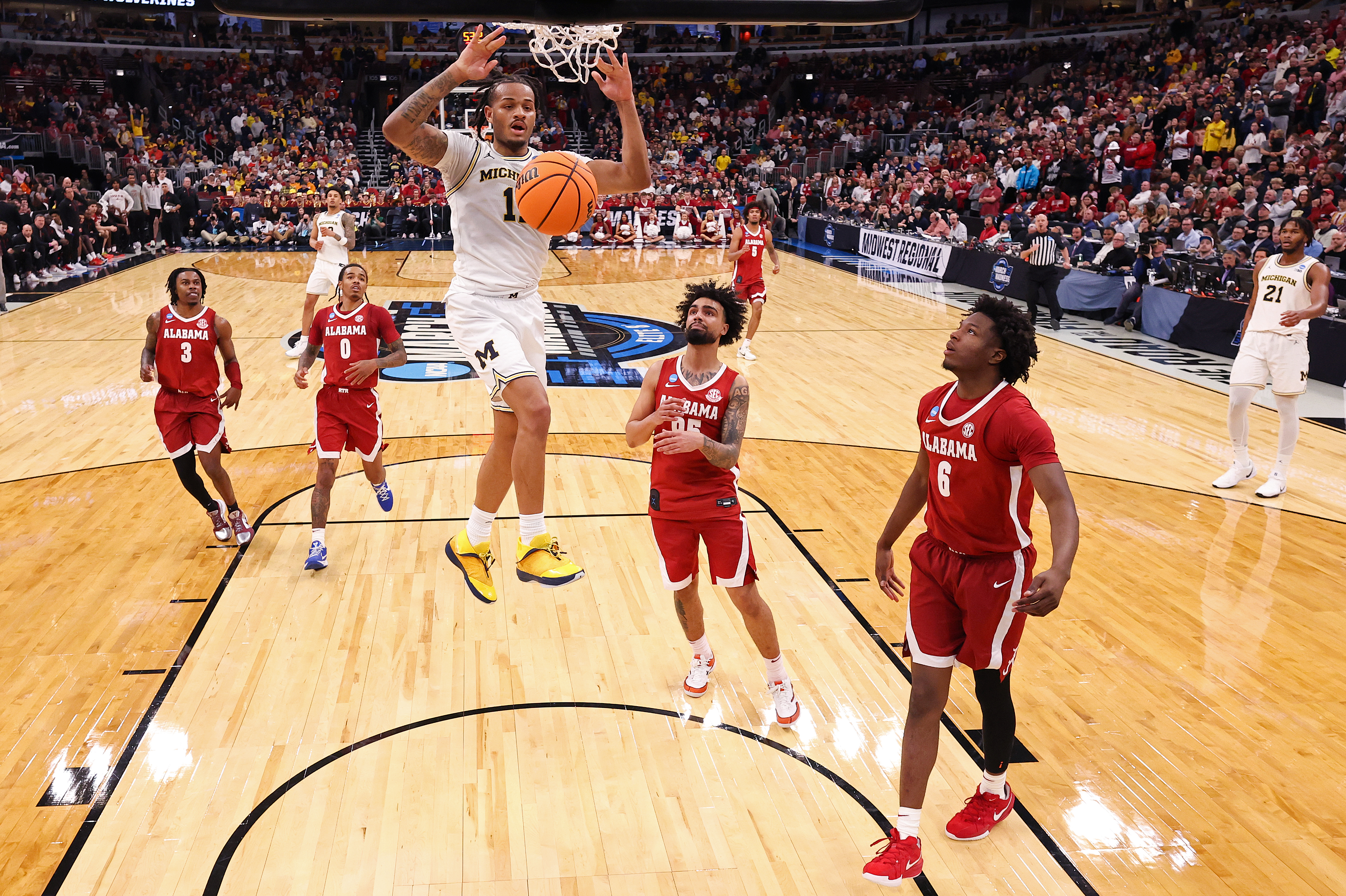 CHICAGO, ILLINOIS - MARCH 27:  Roddy Gayle Jr. #11 of the Michigan Wolverines dunks the ball against the Alabama Crimson Tide during the second half in the Sweet Sixteen of the 2026 NCAA Men's Basketball Tournament at the United Center on March 27, 2026 in Chicago, Illinois. (Photo by Michael Reaves/Getty Images)