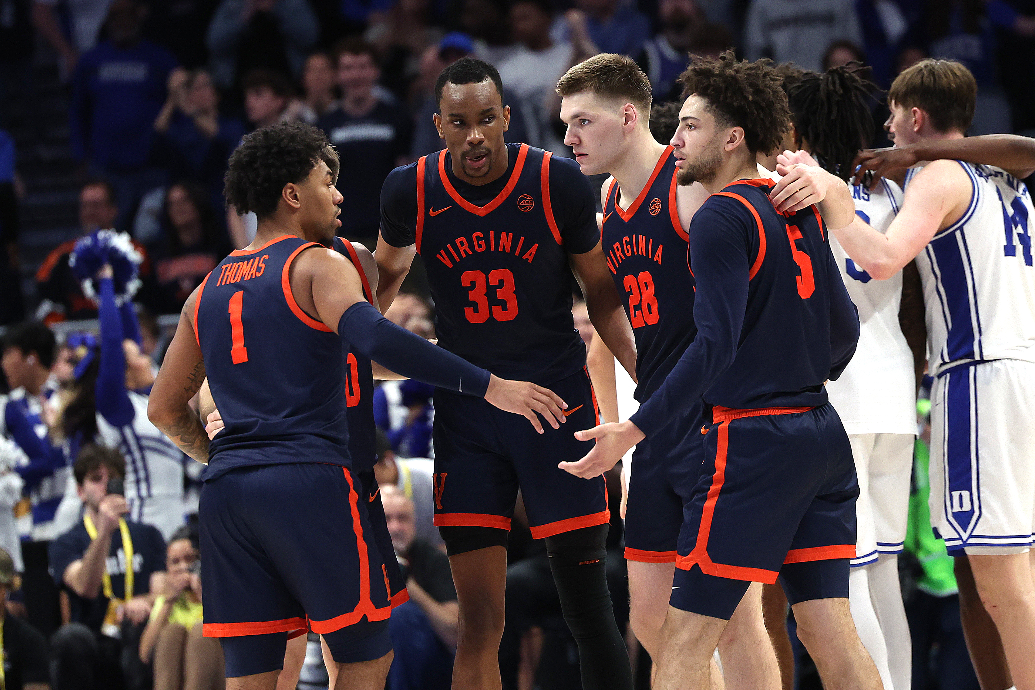CHARLOTTE, NC - MARCH 14: Virginia Cavaliers guard Malik Thomas (1), center Ugonna Onyenso (33), forward Thijs De Ridder (28) and guard Sam Lewis (5) during the ACC Men's basketball tournament finals between the Virginia Cavaliers and the Duke Blue Devils on March 14, 2026 at the Spectrum Center in Charlotte, N.C. (Photo by John Byrum/Icon Sportswire via Getty Images)