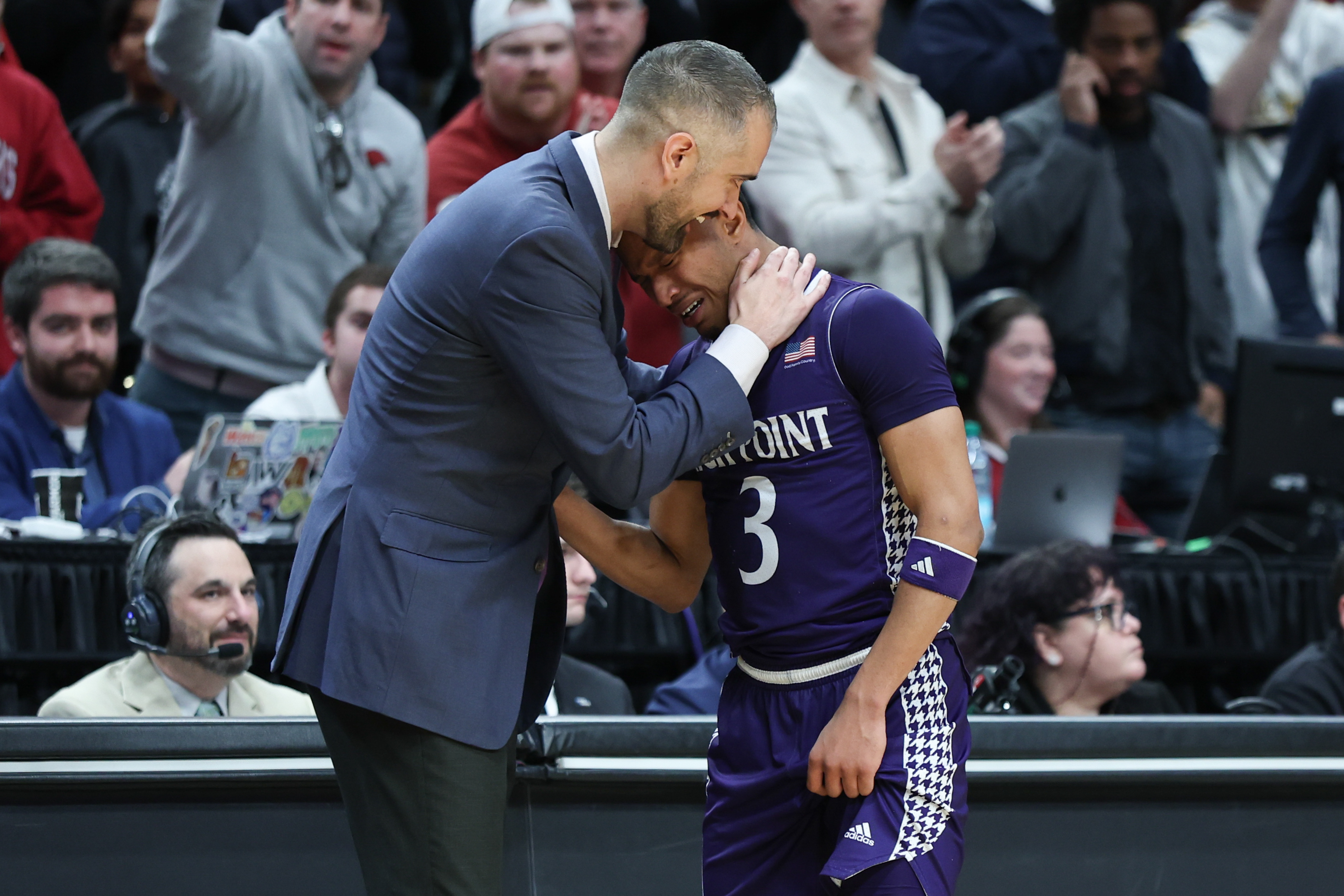 High Point head coach Flynn Clayman talks with guard Rob Martin (3) during the second half in the second round of the NCAA college basketball tournament against Arkansas, Saturday, March 21, 2026, in Portland, Ore. (AP Photo/Craig Mitchelldyer)