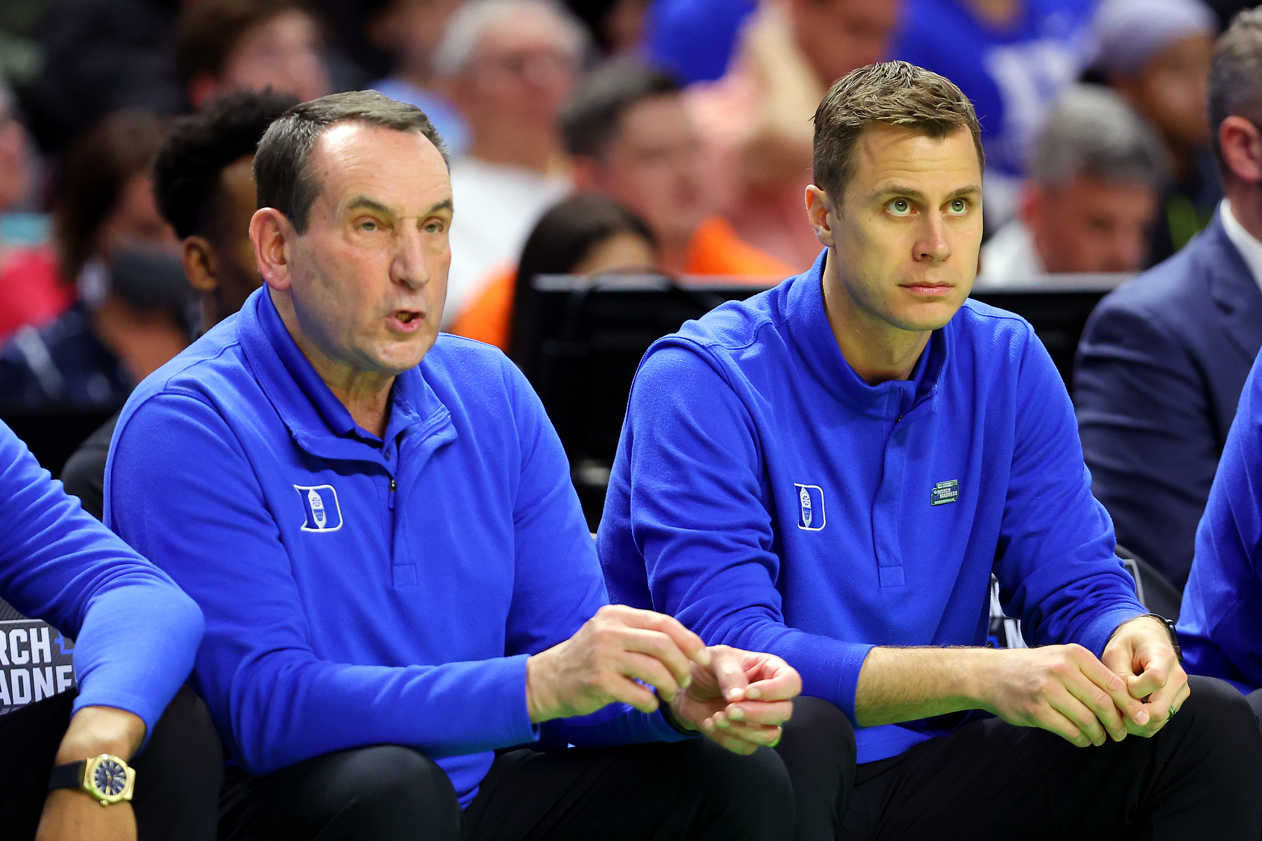 GREENVILLE, SOUTH CAROLINA - MARCH 18: Head coach Mike Krzyzewski and associate head coach Jon Scheyer of the Duke Blue Devils look on during the first half against the Cal State Fullerton Titans in the first round game of the 2022 NCAA Men's Basketball Tournament at Bon Secours Wellness Arena on March 18, 2022 in Greenville, South Carolina. (Photo by Kevin C. Cox/Getty Images)