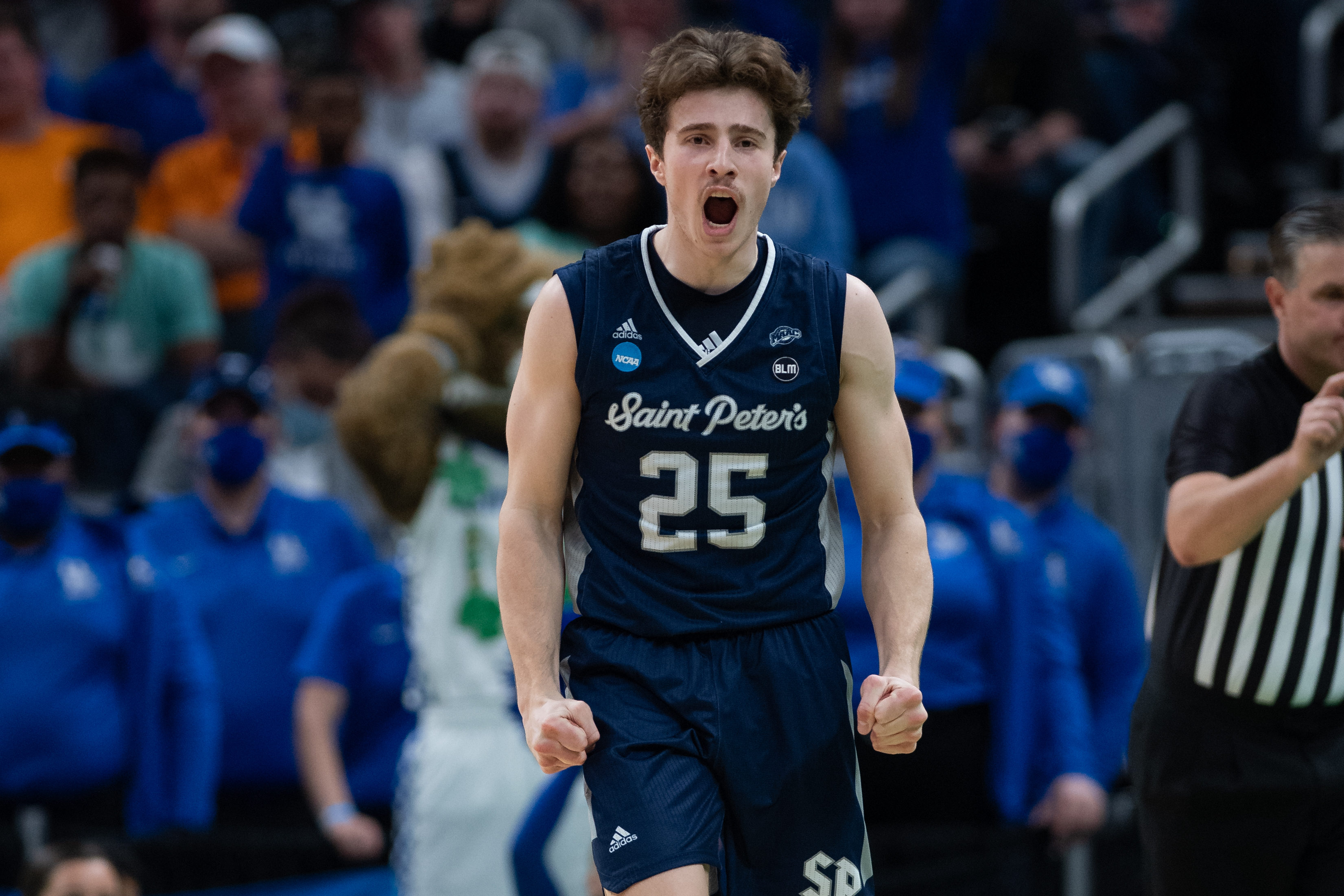 INDIANAPOLIS, IN - MARCH 17: Saint Peter's Peacocks guard Doug Edert (25) celebrates after a turnover during the mens March Madness college basketball game between the Kentucky Wildcats and Saint Peters Peacocks on March 17, 2022, at Gainbridge Fieldhouse in Indianapolis, IN. (Photo by Zach Bolinger/Icon Sportswire via Getty Images)