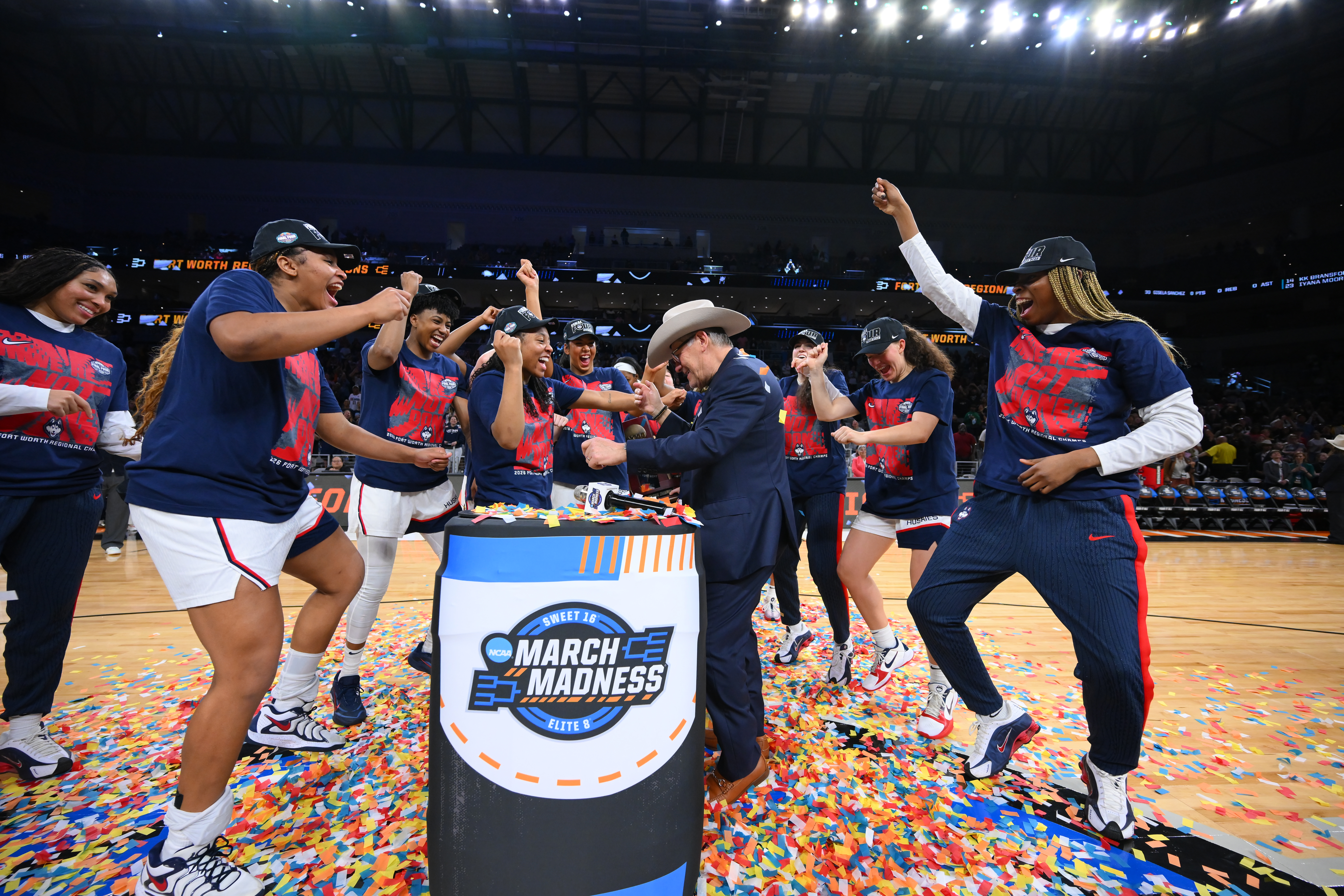 FORT WORTH, TEXAS - MARCH 29: Head coach Geno Auriemma of the UConn Huskies celebrates with his players after the game against the Notre Dame Fighting Irish in an Elite Eight round game of the 2026 NCAA Women's Basketball Tournament held at Dickies Arena on March 29, 2026 in Fort Worth, Texas.  (Photo by Andy Hancock/NCAA Photos/NCAA Photos via Getty Images)