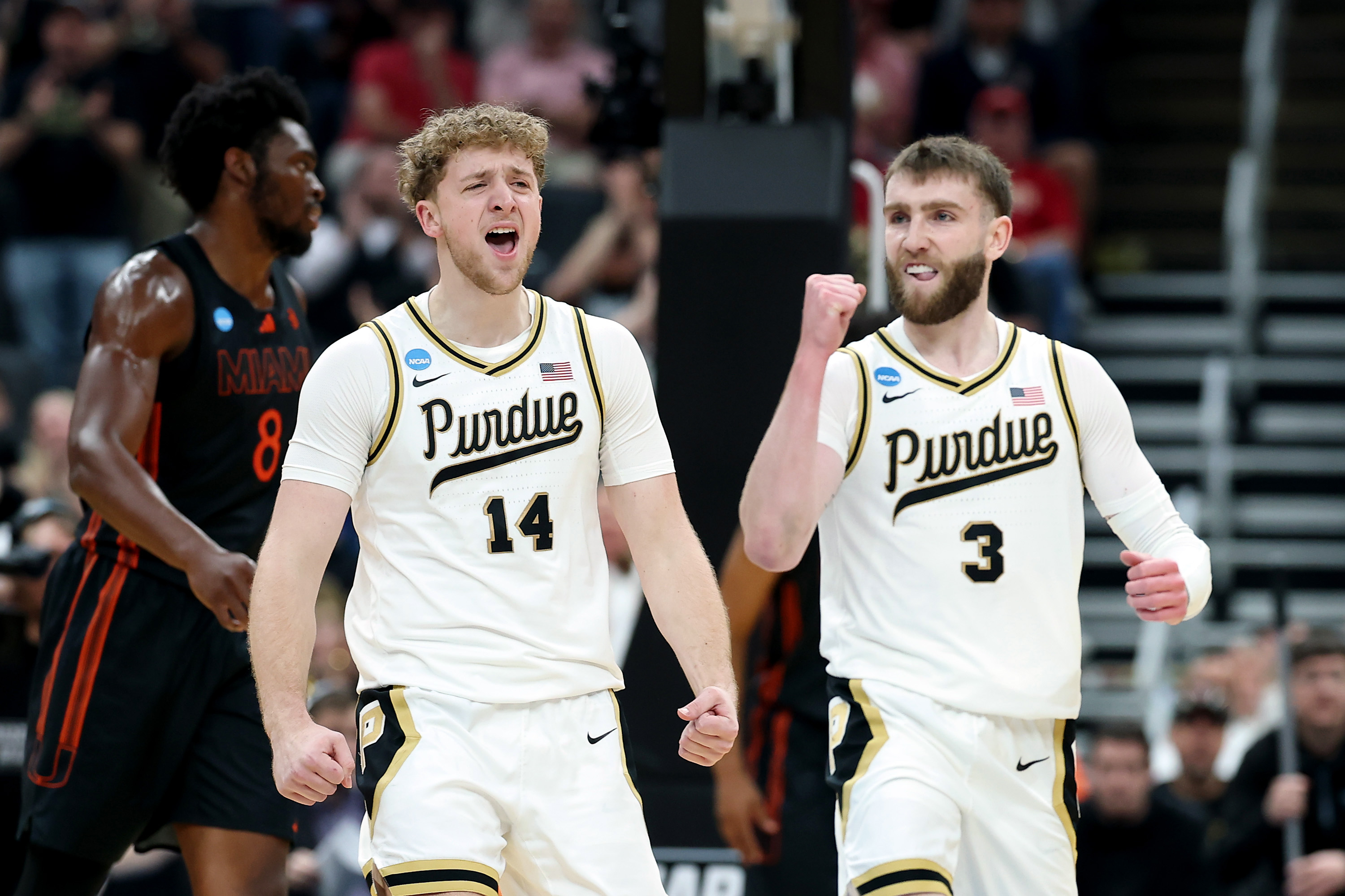 ST LOUIS, MISSOURI - MARCH 22: Jack Benter #14 and Braden Smith #3 of the Purdue Boilermakers react against the Miami Hurricanes during the first half in the second round of the 2026 NCAA Men's Basketball Tournament at Enterprise Center on March 22, 2026 in St Louis, Missouri.  (Photo by Jamie Squire/Getty Images)