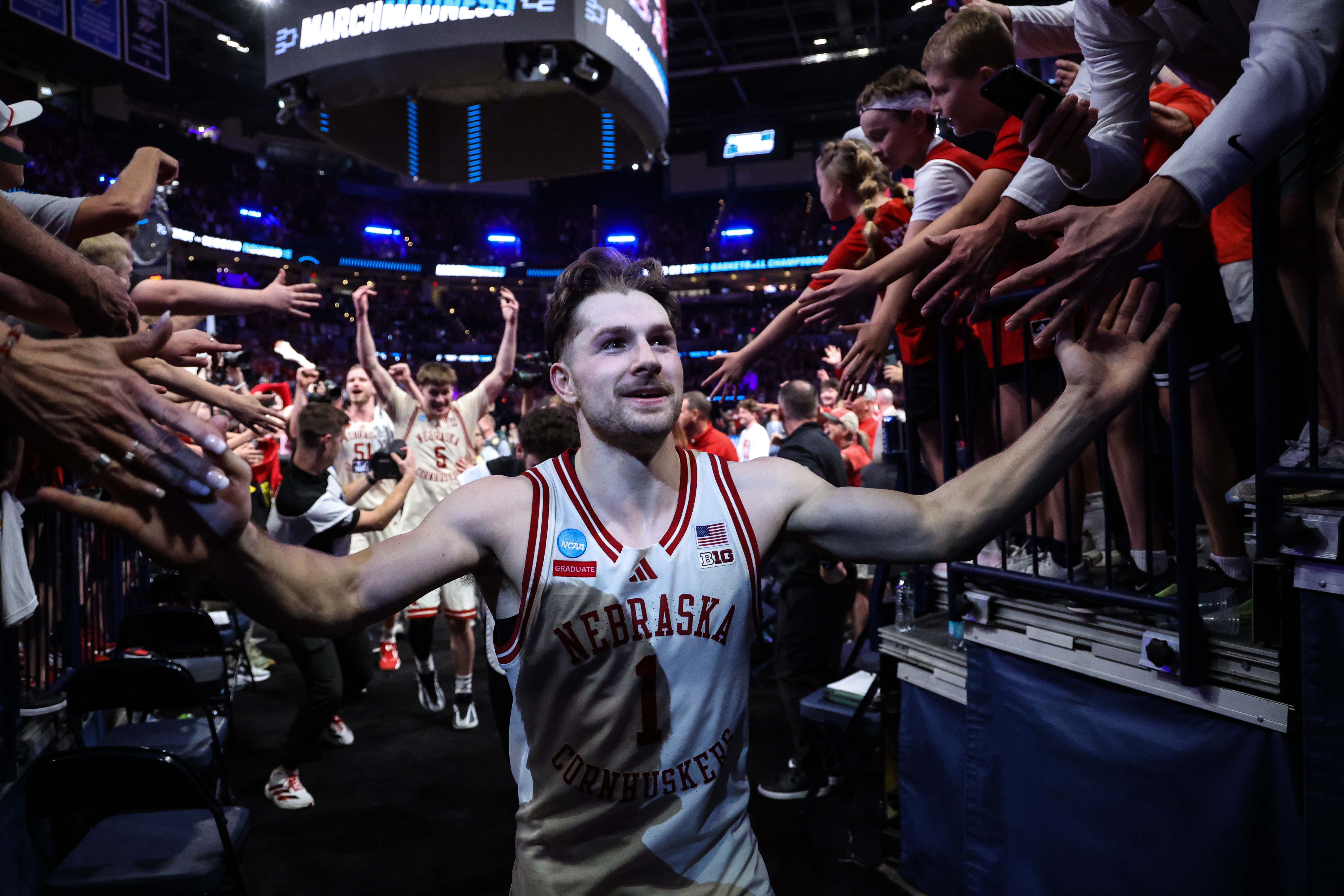 OKLAHOMA CITY, OKLAHOMA - MARCH 21: Sam Hoiberg #1 of the Nebraska Cornhuskers celebrates with fans after the second round of the 2026 NCAA Men's Basketball Tournament against the Vanderbilt Commodores held at Paycom Center on March 21, 2026 in Oklahoma City, Oklahoma.  (Photo by Shane Bevel/NCAA Photos via Getty Images)