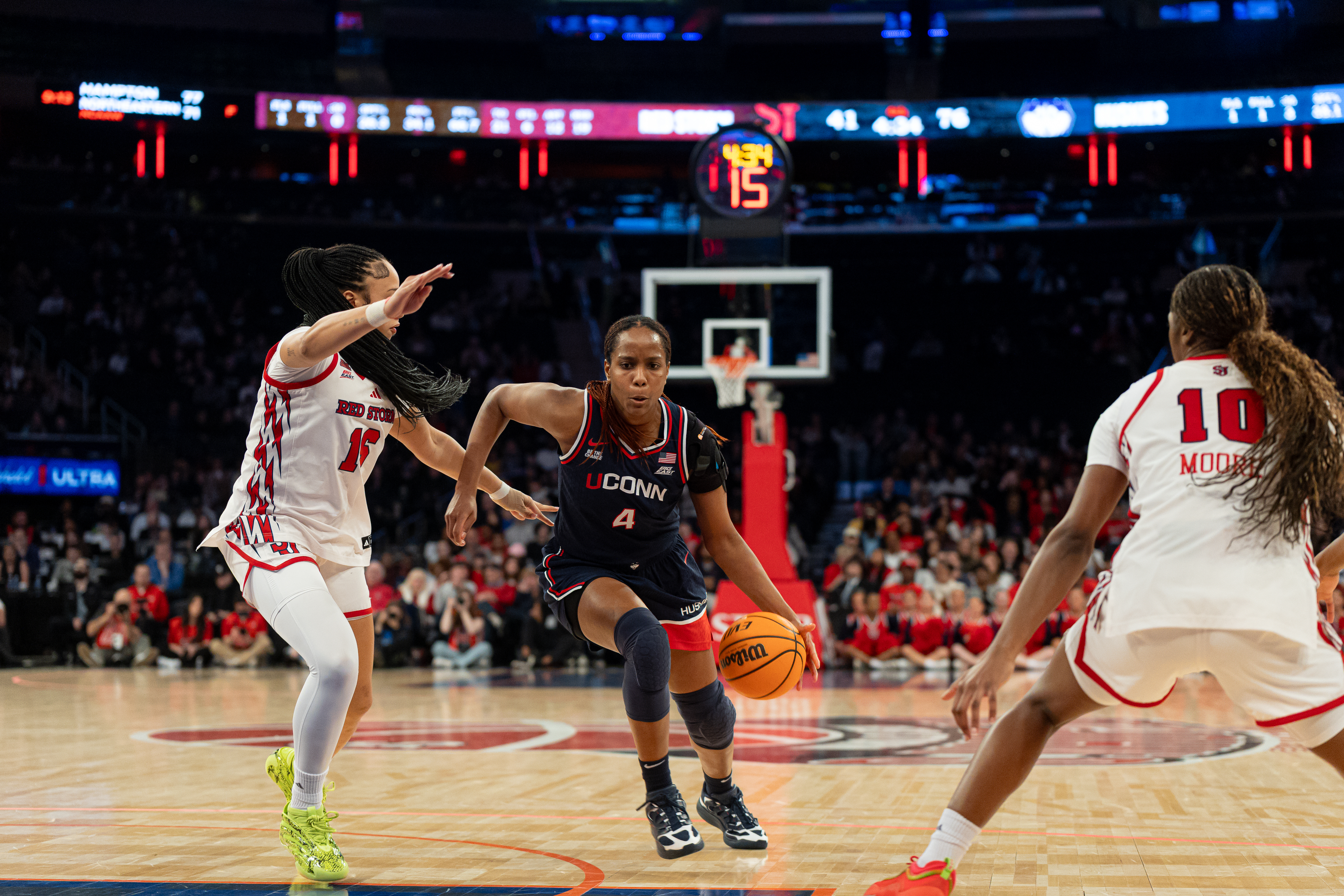 Blanca Quinonez #4 of the UConn Huskies drives to the basket against Daniela Abies #16 and Brooke Moore #10 of the St. John's Red Storm during the second half of the game at Madison Square Garden in New York City, United States, on March 1, 2026. (Photo by Federico Torres/NurPhoto via Getty Images)