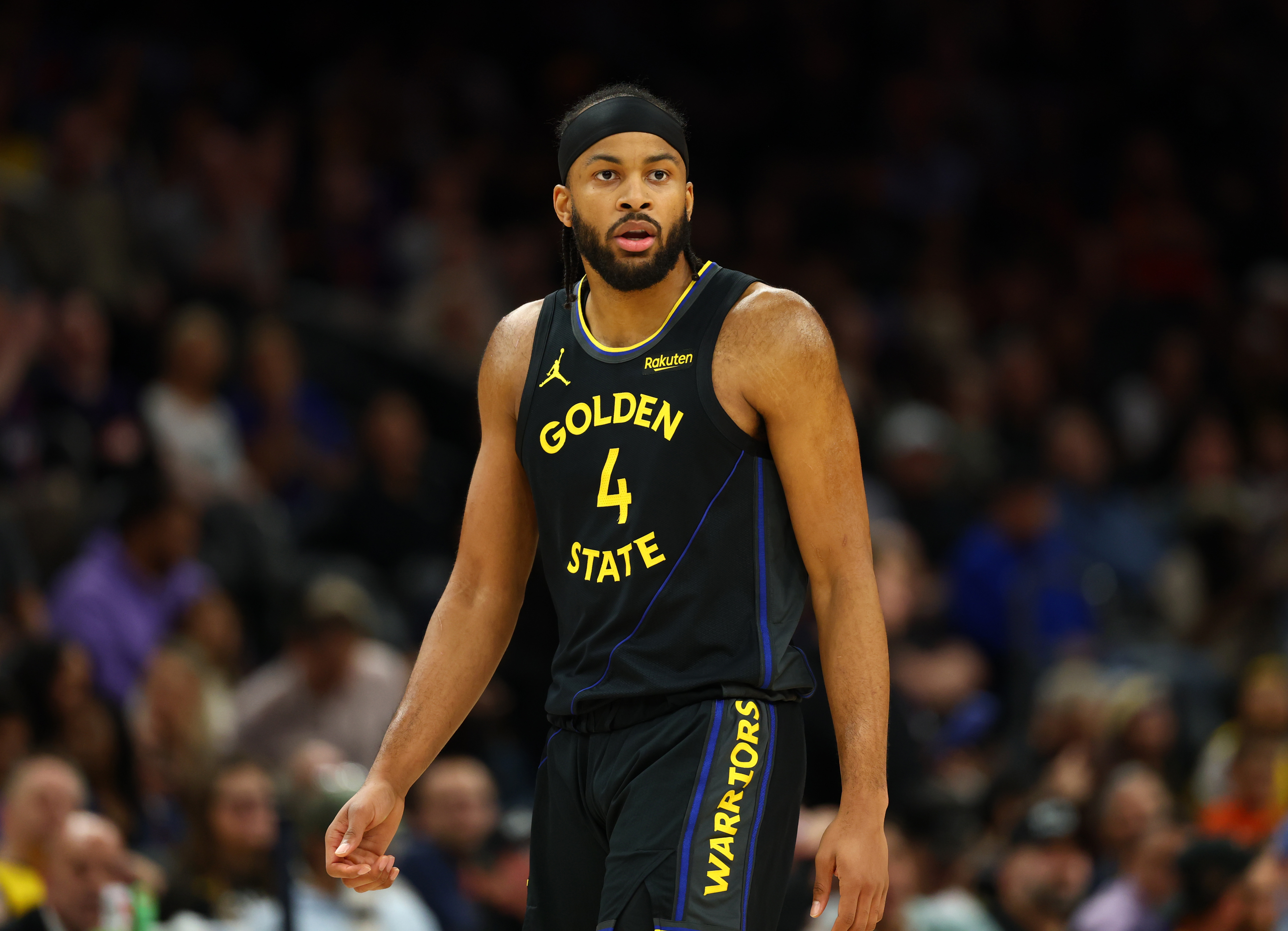 Feb 5, 2026; Phoenix, Arizona, USA; Golden State Warriors guard Moses Moody (4) against the Phoenix Suns at Mortgage Matchup Center. Mandatory Credit: Mark J. Rebilas-Imagn Images