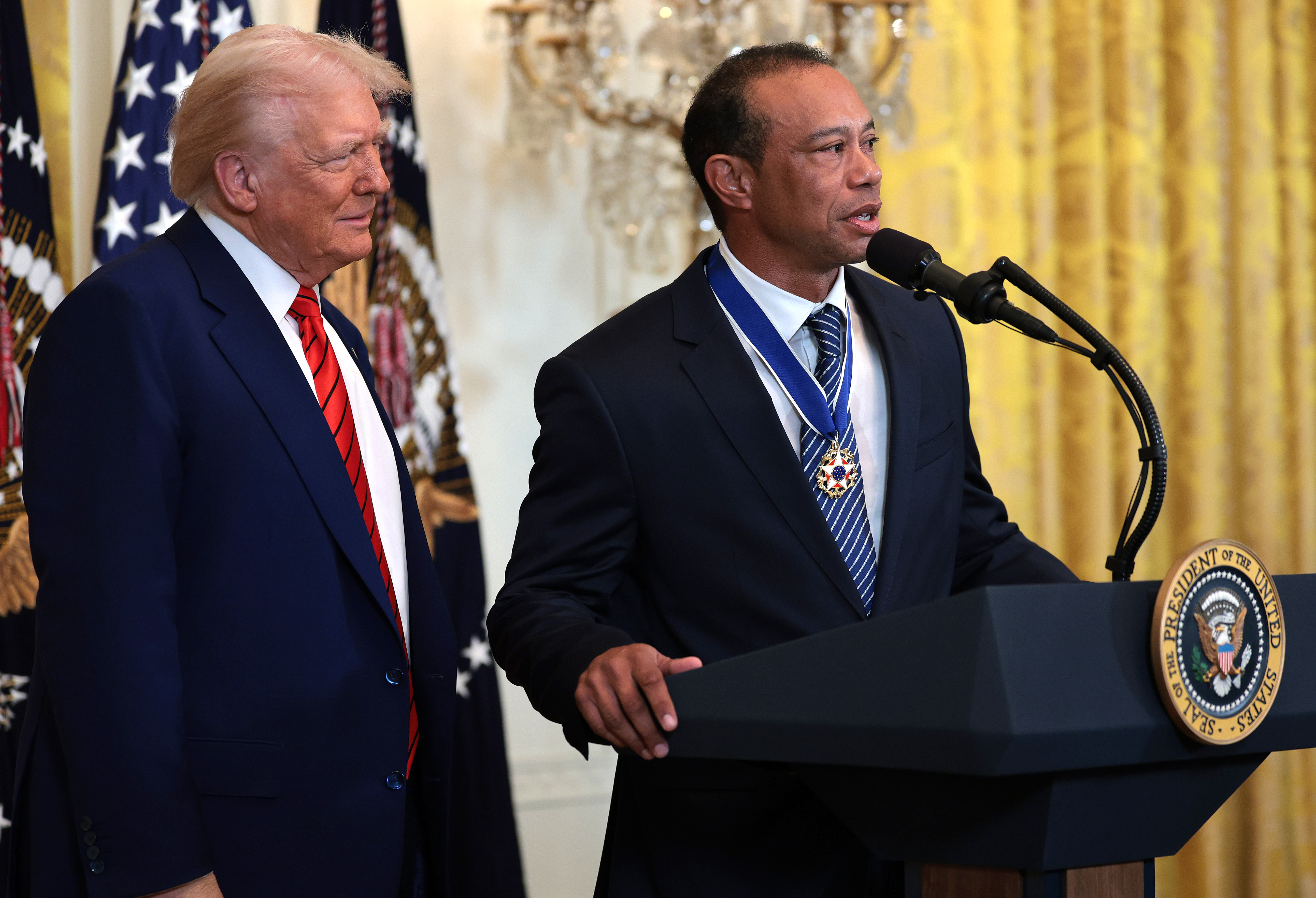WASHINGTON, DC - FEBRUARY 20: Gold legend Tiger Woods speaks alongside U.S. President Donald Trump during a reception honoring Black History Month in the East Room of the White House on February 20, 2025 in Washington, DC. The Black History Month celebration comes as Trump has signed a series of executive orders ending federal diversity, equity and inclusion (DEI) programs and cutting funding to schools and Universities that do not cut DEI programs. (Photo by Win McNamee/Getty Images)