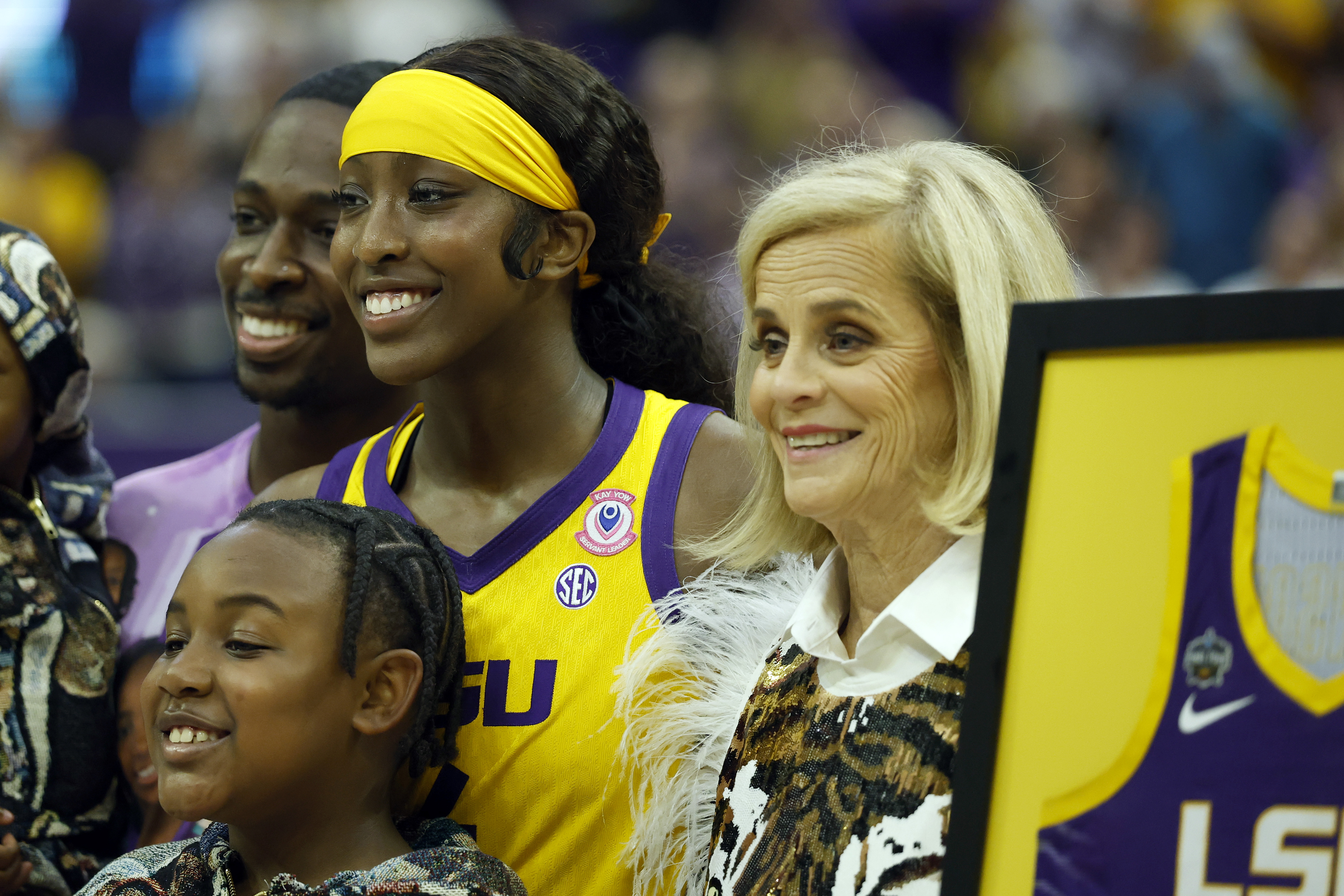 BATON ROUGE, LOUISIANA - FEBRUARY 26: Head coach Kim Mulkey of the LSU Tigers stands with Flau'jae Johnson #4 of the LSU Tigers during a presentation during a game against the Tennessee Lady Volunteers at Pete Maravich Assembly Center on February 26, 2026 in Baton Rouge, Louisiana. (Photo by Tyler Kaufman/Getty Images)
