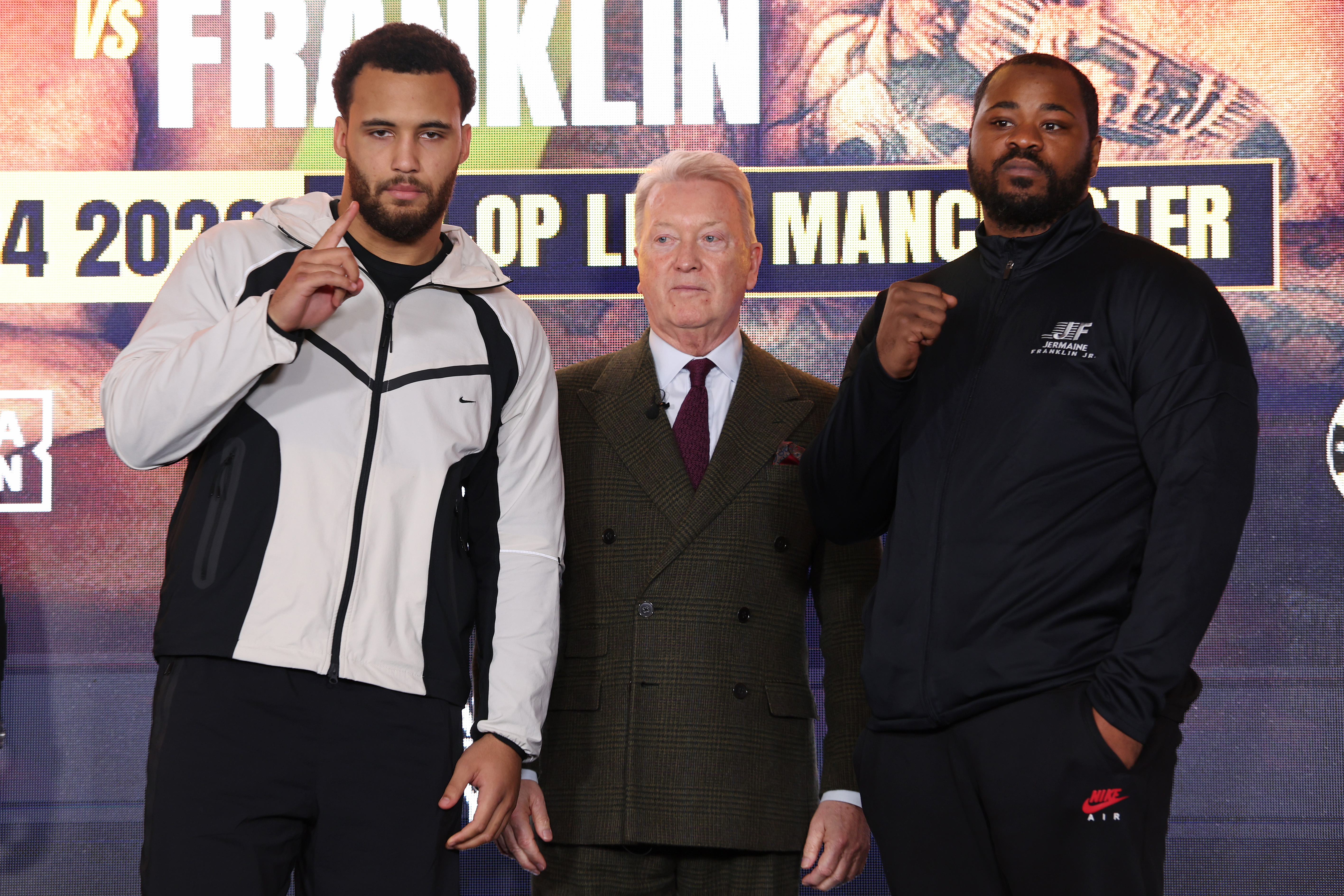 MANCHESTER, ENGLAND - NOVEMBER 17: Moses Itauma and Jermaine Franklin go head to head as Frank Warren of Queensberry Promotions looks on during the Magnificent 7 Launch Press Conference at Co-op Live on November 17, 2025 in Manchester, England. (Photo by Alex Livesey/Getty Images)