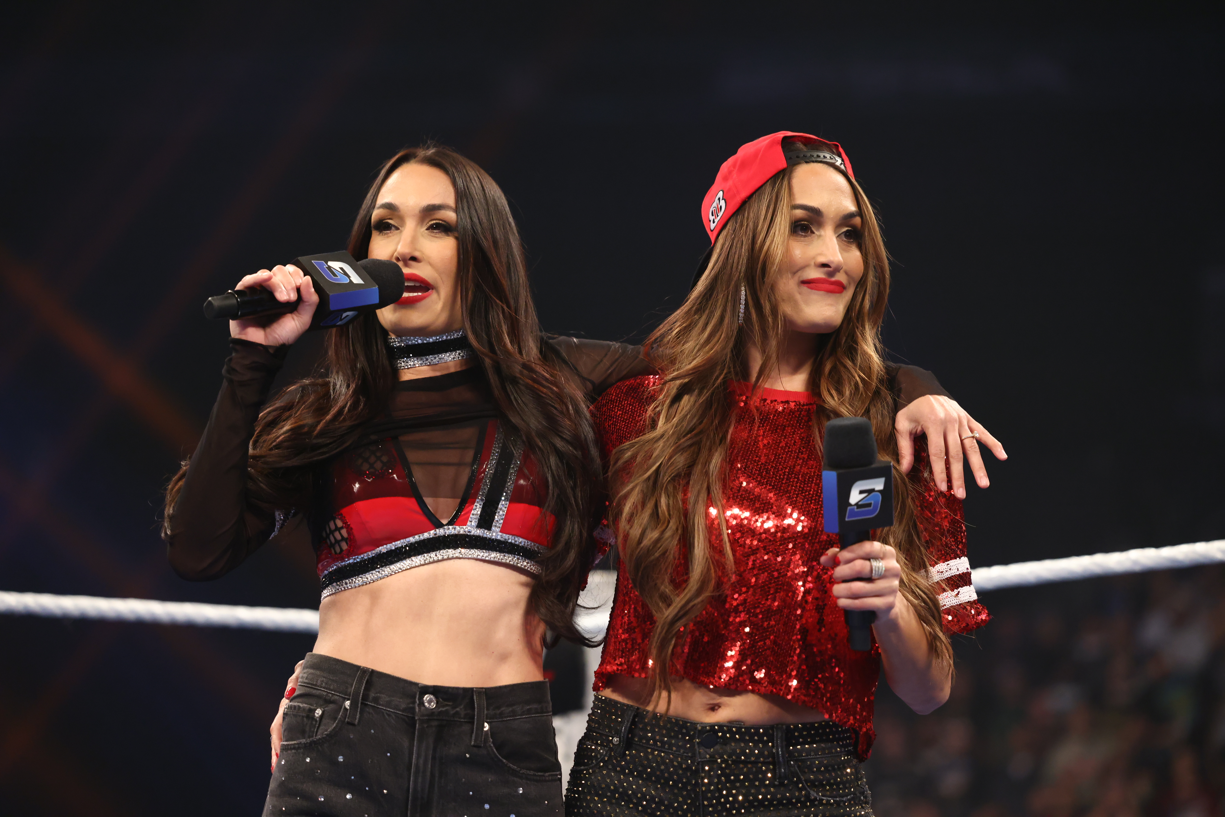 PHOENIX, ARIZONA - MARCH 13: Brie Bella and Nikki Bella address the crowd during SmackDown at Mortgage Matchup Center on March 13, 2026 in Phoenix, Arizona.  (Photo by Bradlee Rutledge/WWE via Getty Images)