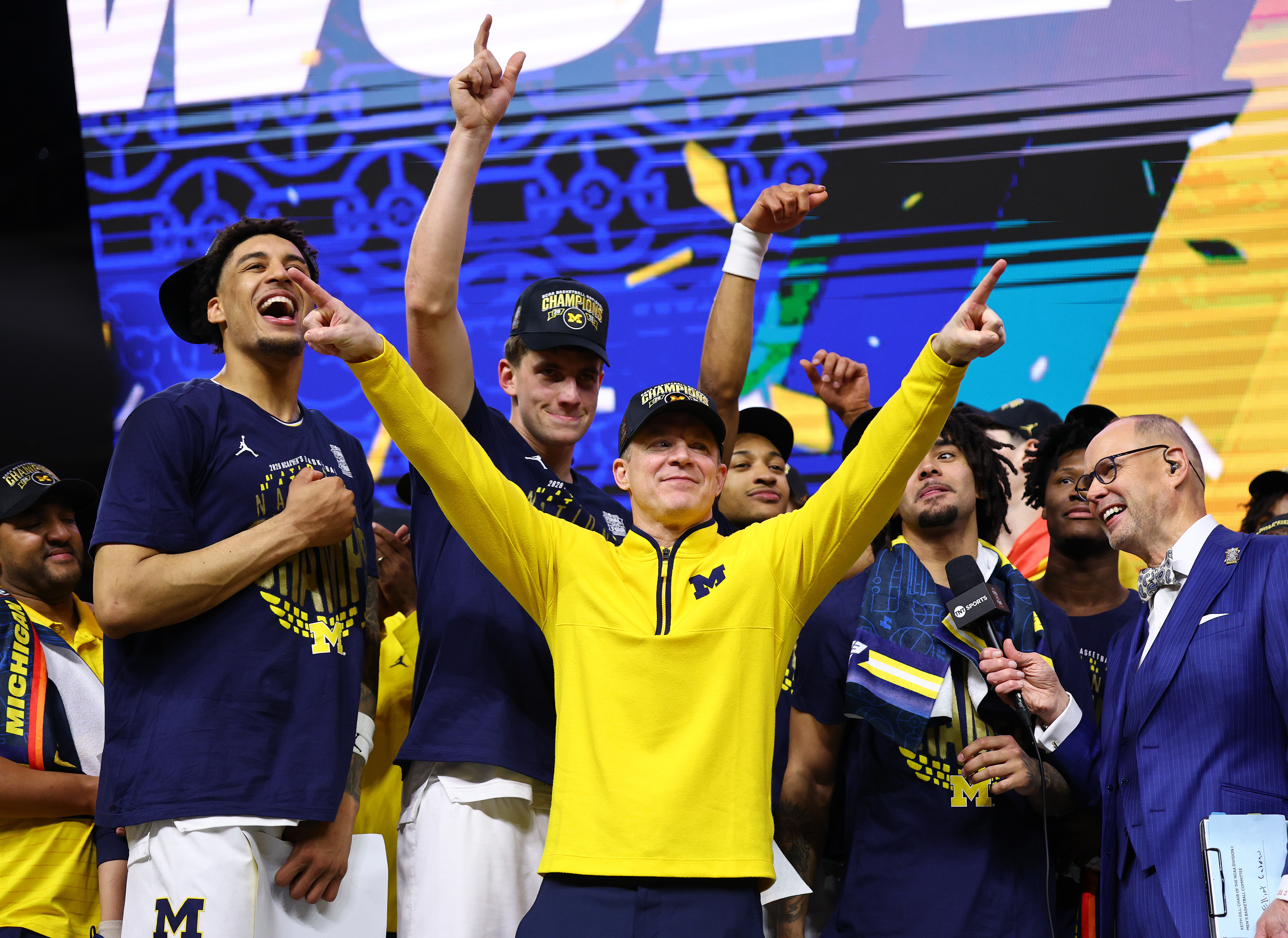 INDIANAPOLIS, INDIANA - APRIL 06: Head Coach Dusty May of the Michigan Wolverines celebrates with his team after defeating the UConn Huskies in the National Championship of the 2026 NCAA Men's Basketball Tournament at Lucas Oil Stadium on April 06, 2026 in Indianapolis, Indiana. (Photo by Jamie Schwaberow/NCAA Photos via Getty Images)