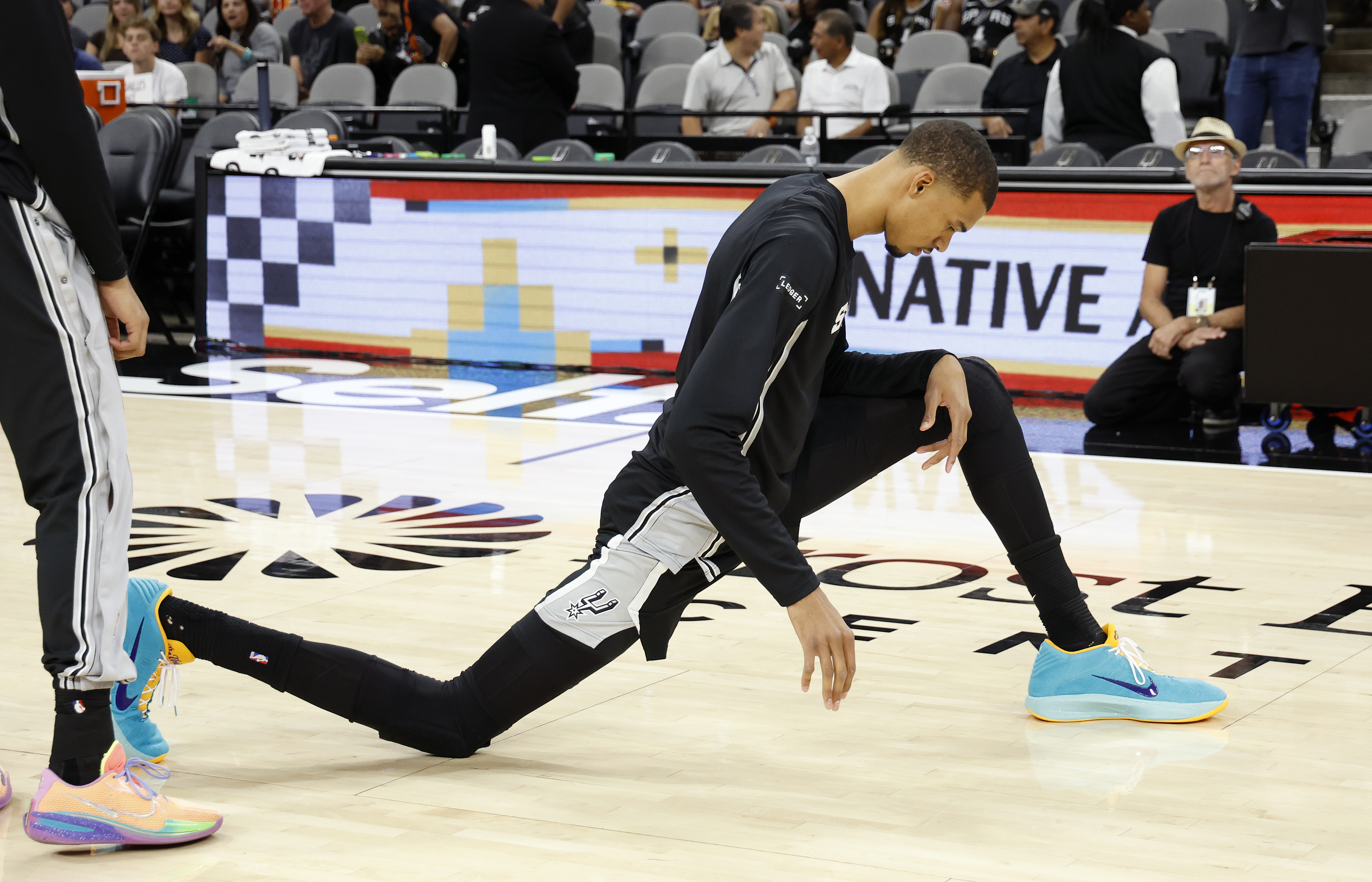  Victor Wembanyama #1 of the San Antonio Spurs stretches before the start of their game against the Philadelphia 76ers at Frost Bank Center on April 6, 2026 in San Antonio, Texas. NOTE TO USER: User expressly acknowledges and agrees that, by downloading and or using this photograph, User is consenting to terms and conditions of the Getty Images License Agreement. (Photo by Ronald Cortes/Getty Images)