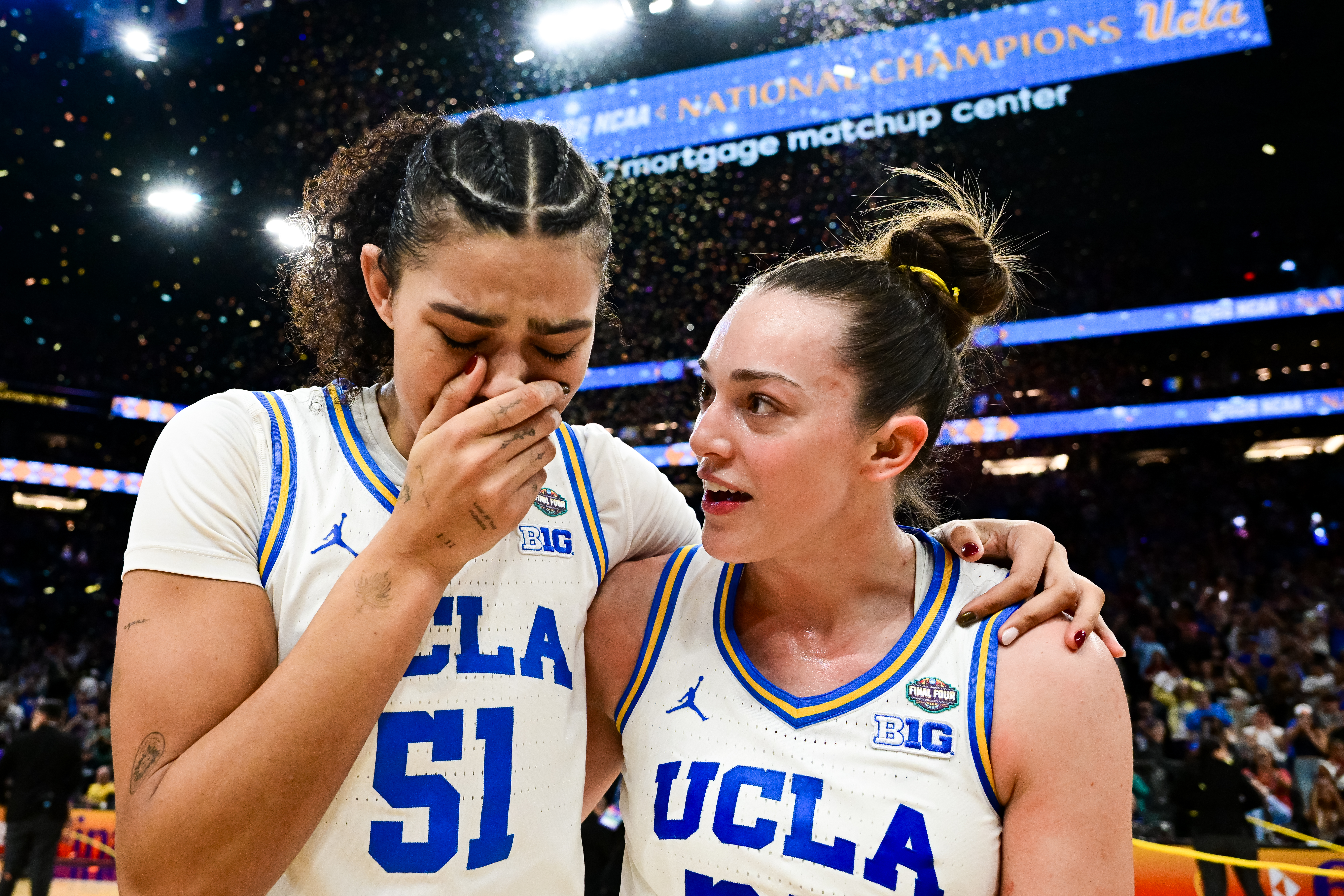 PHOENIX, ARIZONA - APRIL 5: Lauren Betts #51 and Angela Dugali #32 of the UCLA Bruins react after defeating the South Carolina Gamecocks in the NCAA Women's Basketball Championship game at Mortgage Matchup Center on April 5, 2026 in Phoenix, Arizona. (Photo by Ben Solomon/NCAA Photos via Getty Images)