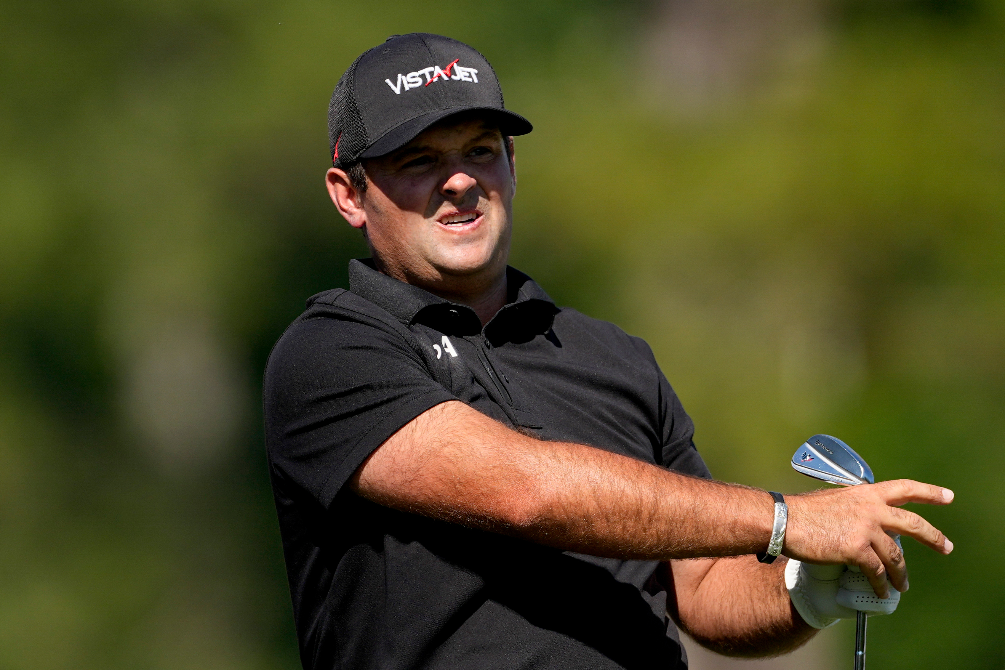 Patrick Reed watches his tee shot on the 12th hole during the second round of the Masters golf tournament at the Augusta National Golf Club, Friday, April 10, 2026, in Augusta, Ga. (AP Photo/Eric Gay)