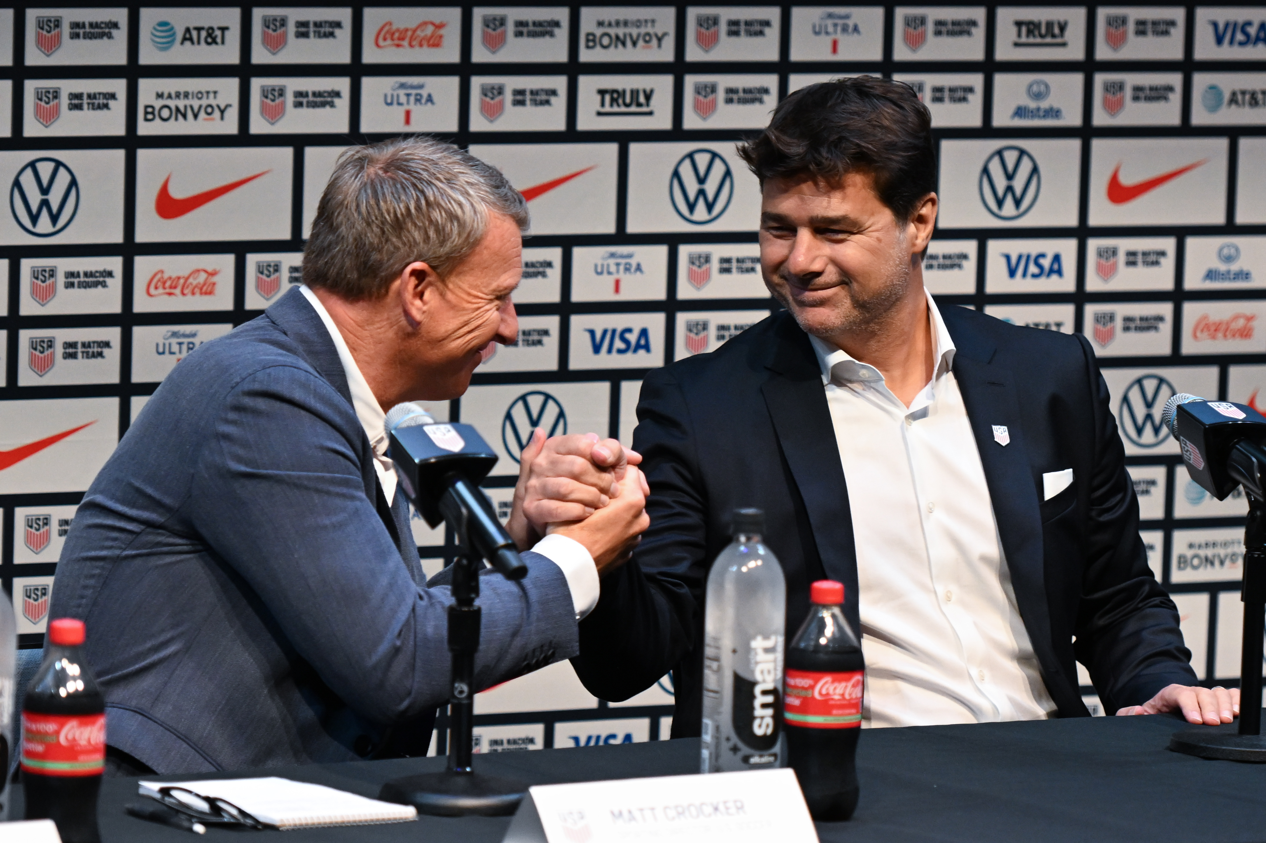 NEW YORK, NEW YORK - SEPTEMBER 13: Mauricio Pochettino and Matt Crocker shake hands during Mauricio Pochettino's first press conference as head coach of the U.S. Mens National Team at Hudson Yards on September 13, 2024 in New York City. (Photo by Stephen Nadler/ISI Photos/Getty Images)